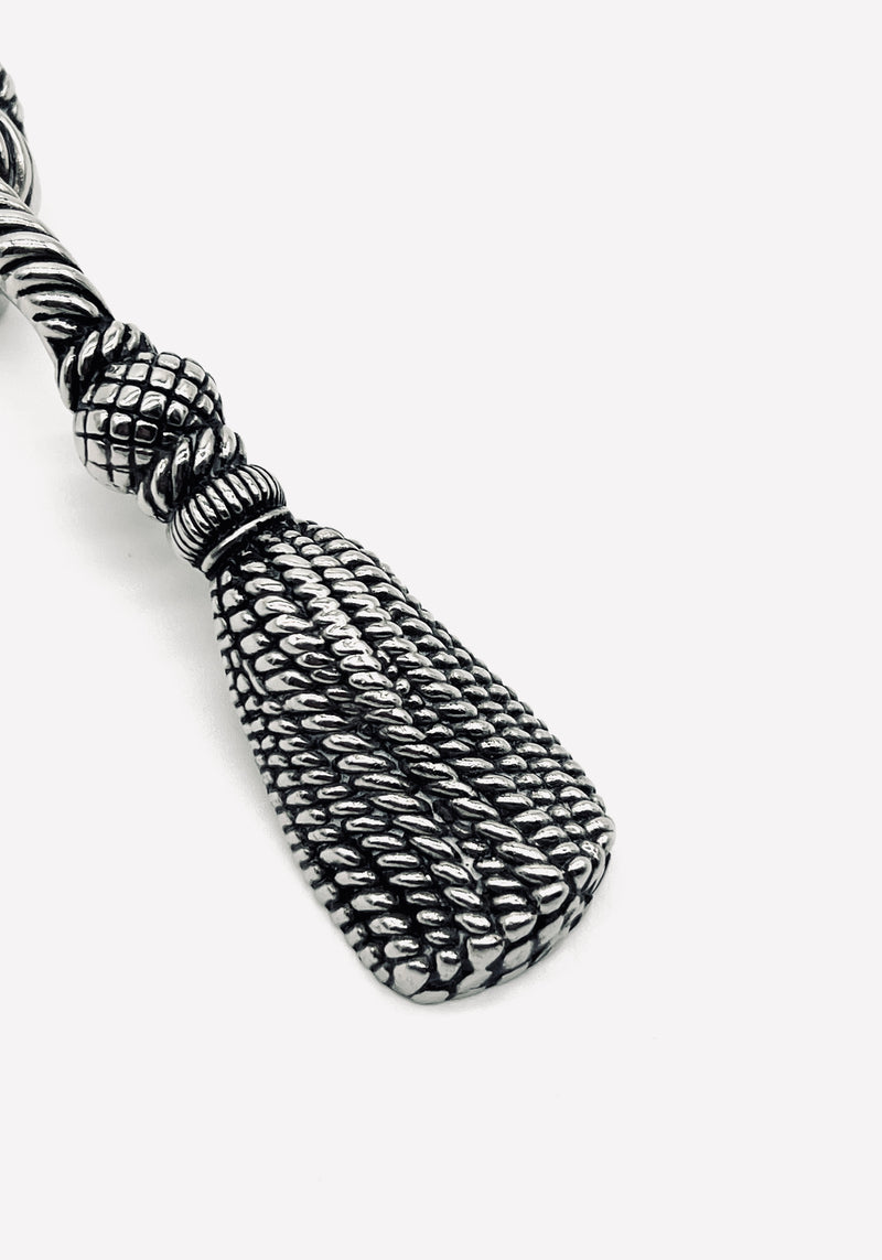 Ornate silver-plated tassel bottle opener with detailed rope texture