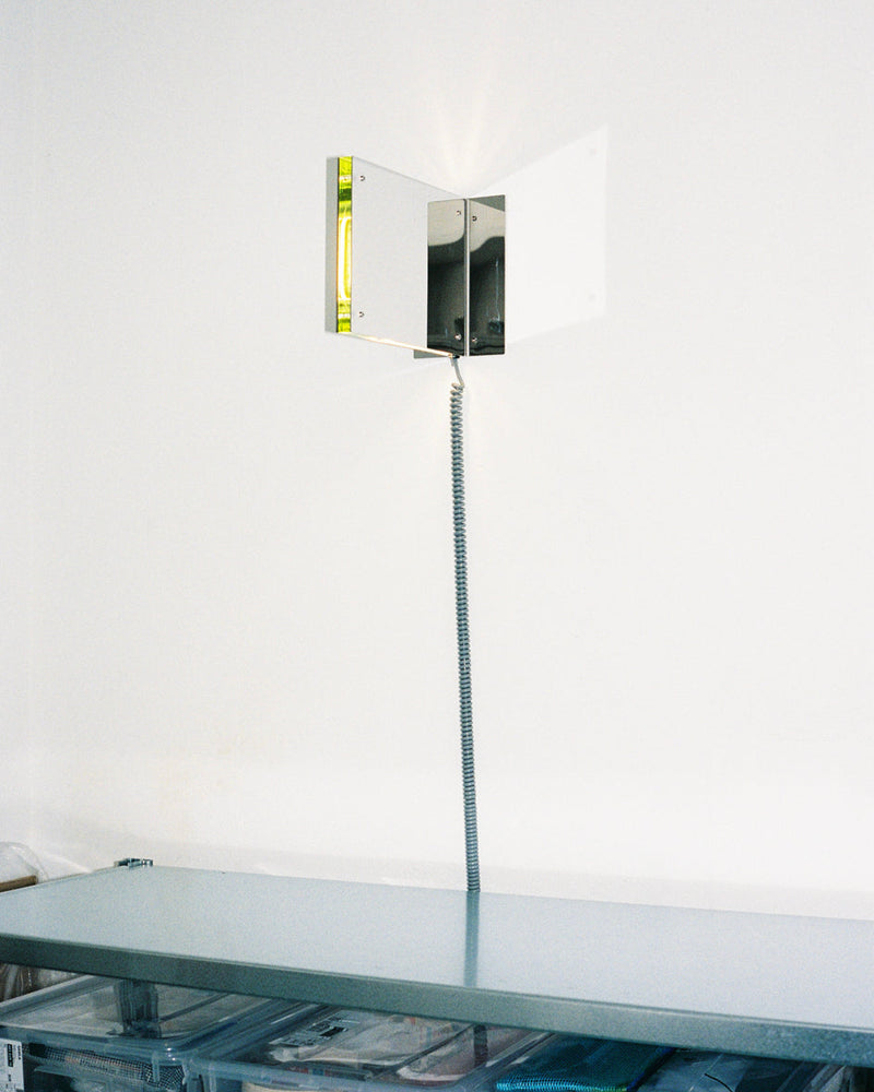 Contemporary wall-mounted table lamp with yellow fluorescent tube
