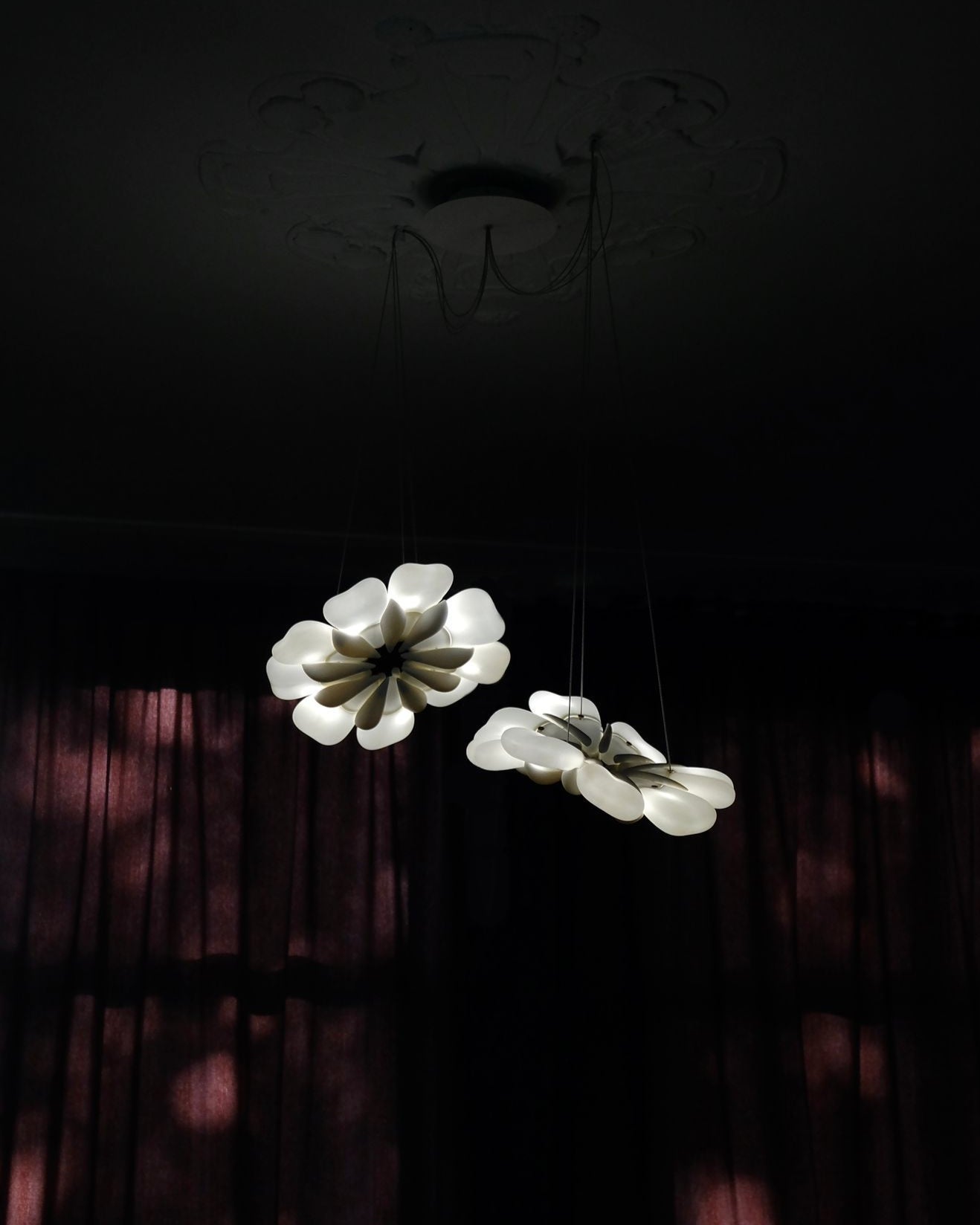 Pelagi' Pendant Light — side angle with three white floral-shaped shades