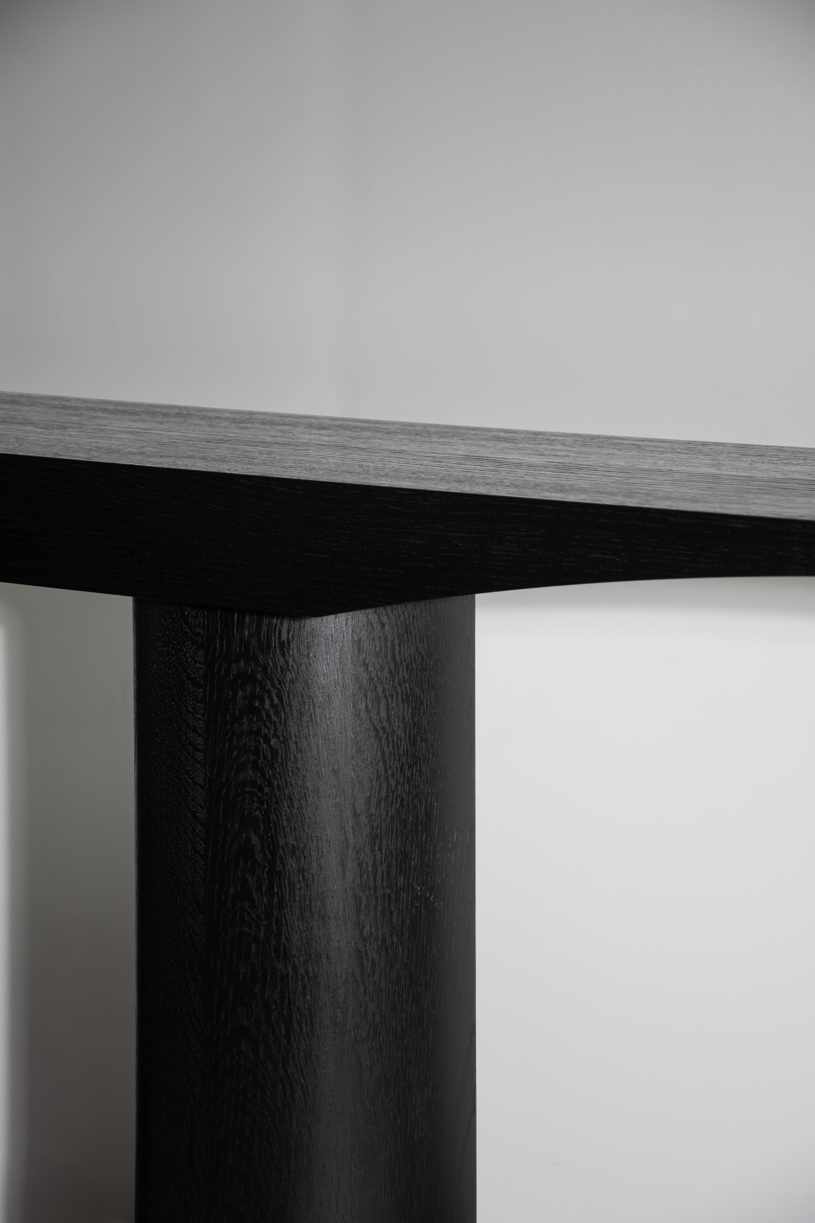 Corps - Console — side angle of black wood table leg