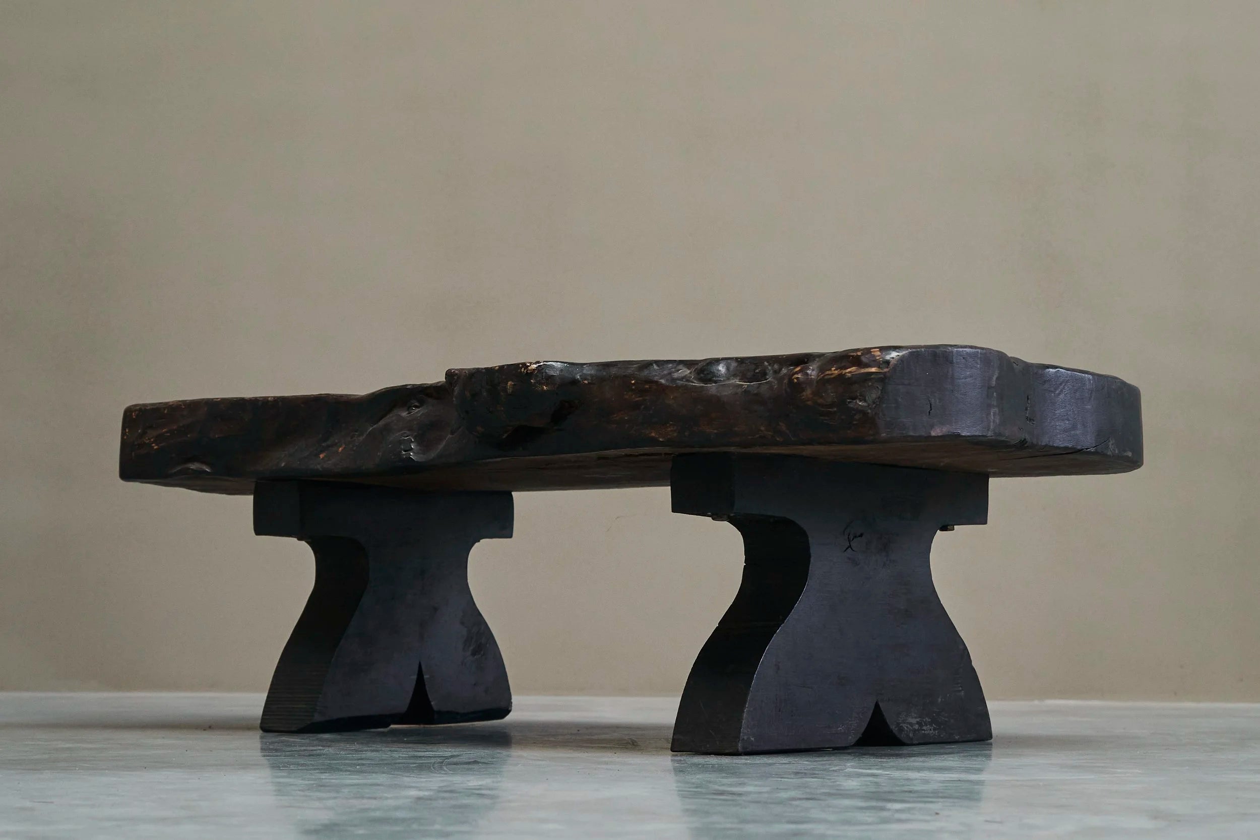 Sculptural Live Edge Coffee Table in Solid Dark Stained Wood — side angle
