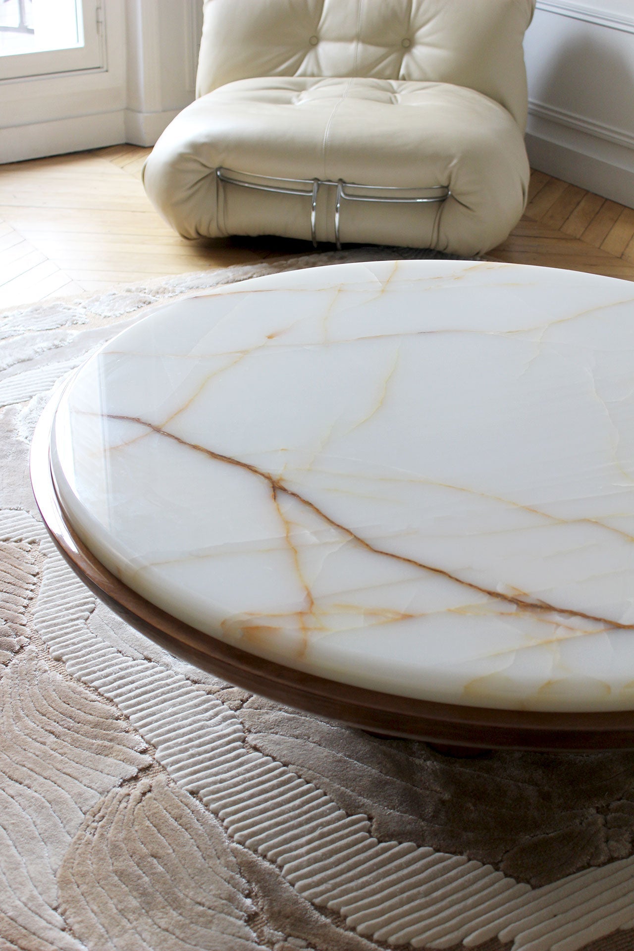 Edoni Wood and Shell Onyx Coffee Table — close-up of onyx surface in living room
