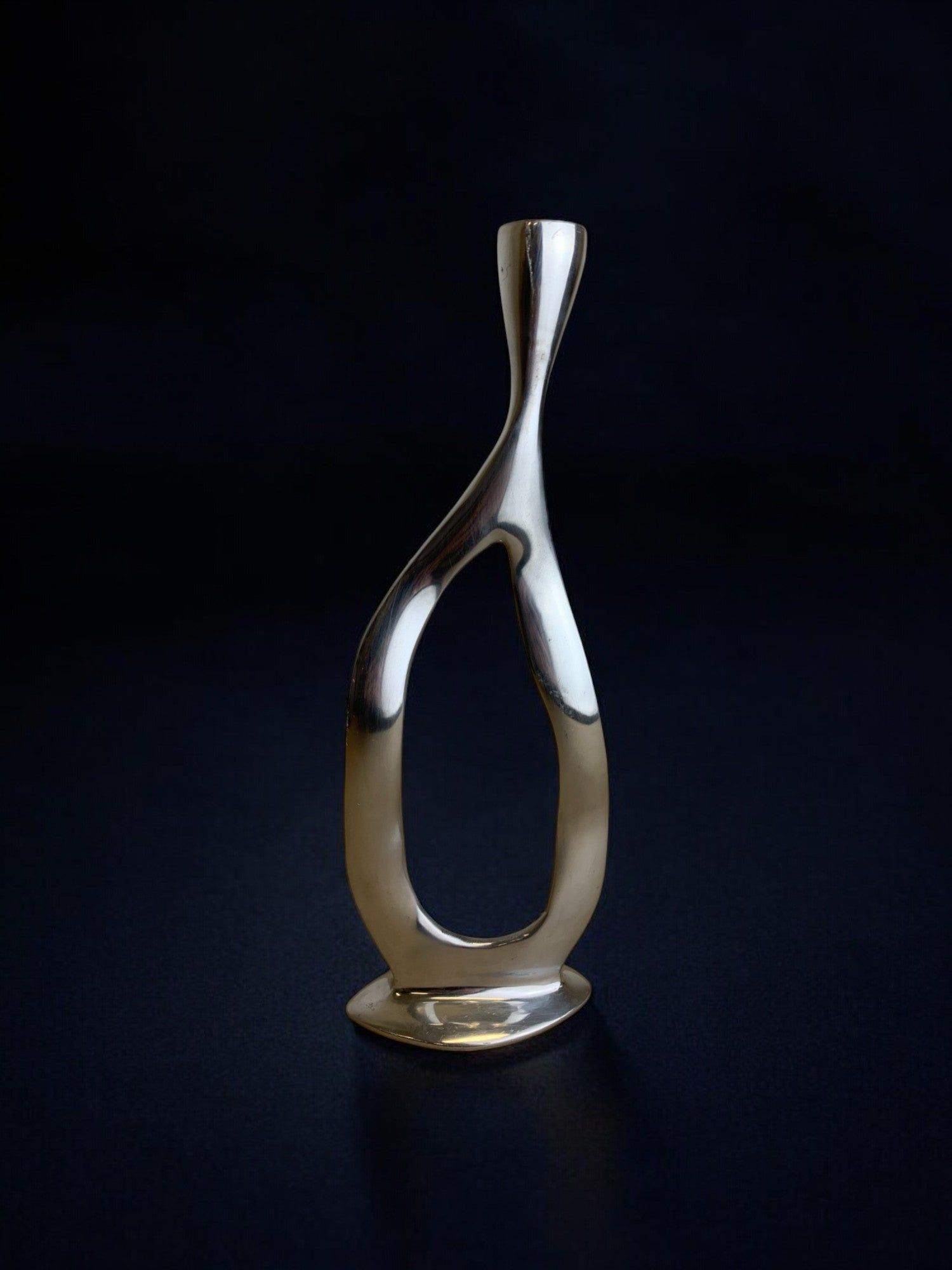 Biomorphic Candleholder, Aluminum, Spain, Circa 1970s — angled view on dark background