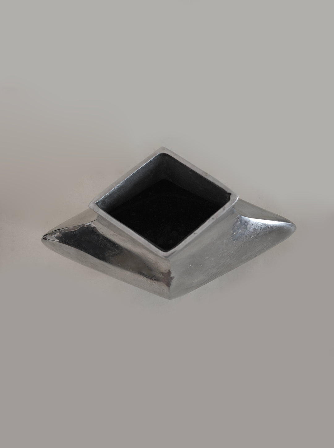 Sculptural Chrome Vase — top view showing square opening and shiny surface