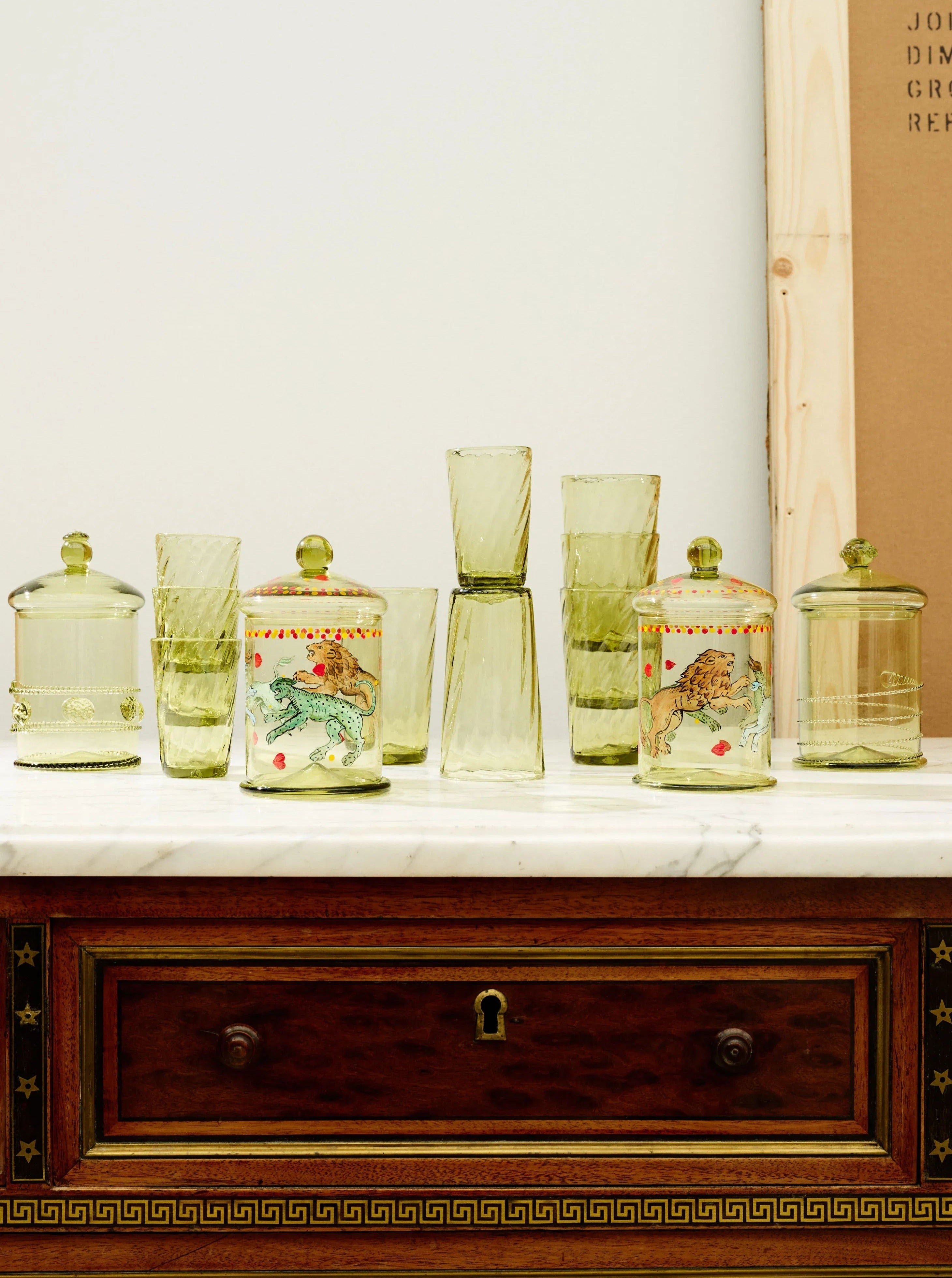 Karl Bonbonnière Swirl — side angle with green glass jars on marble