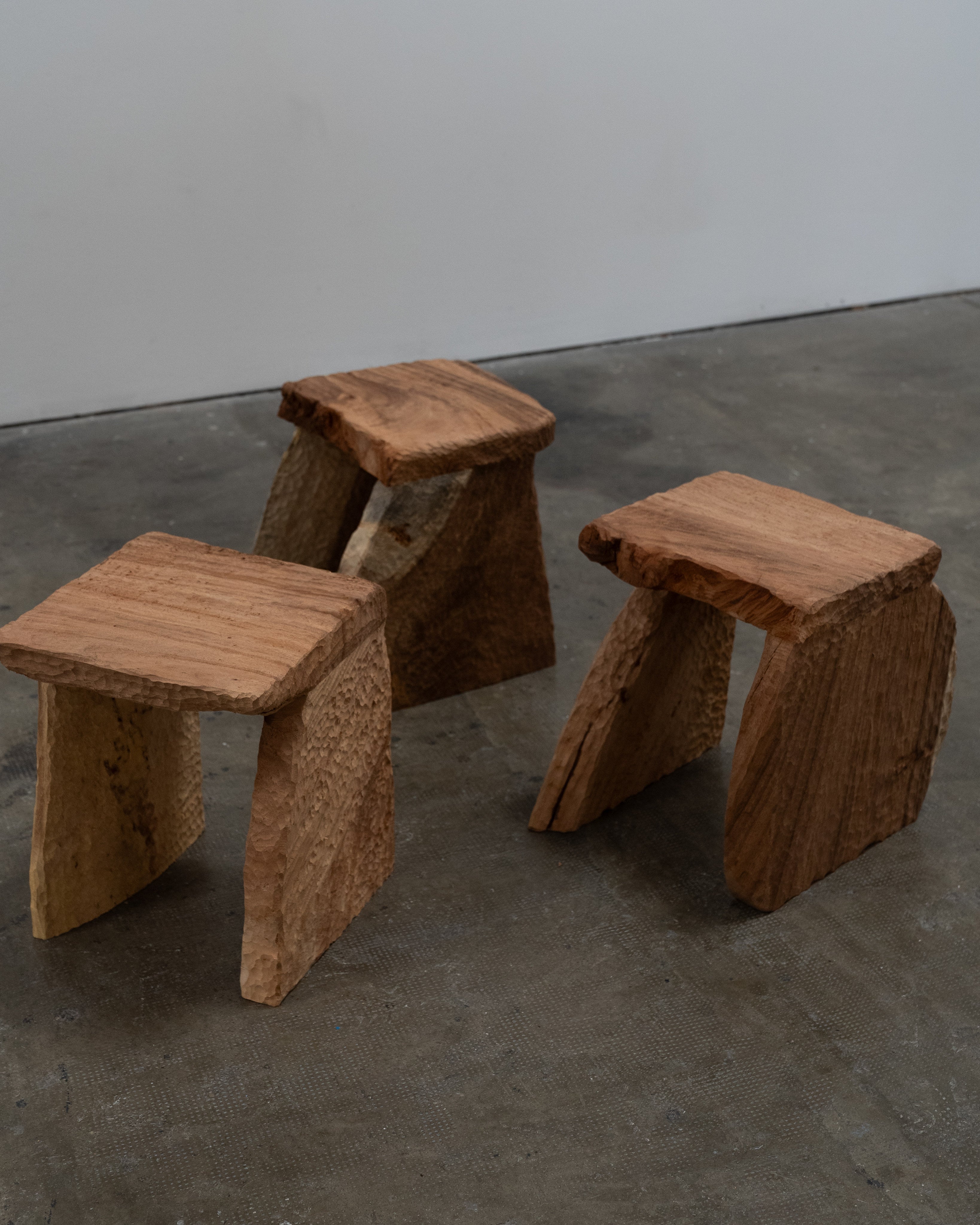 Massif Carved Stool in Eucalyptus Wood — in context