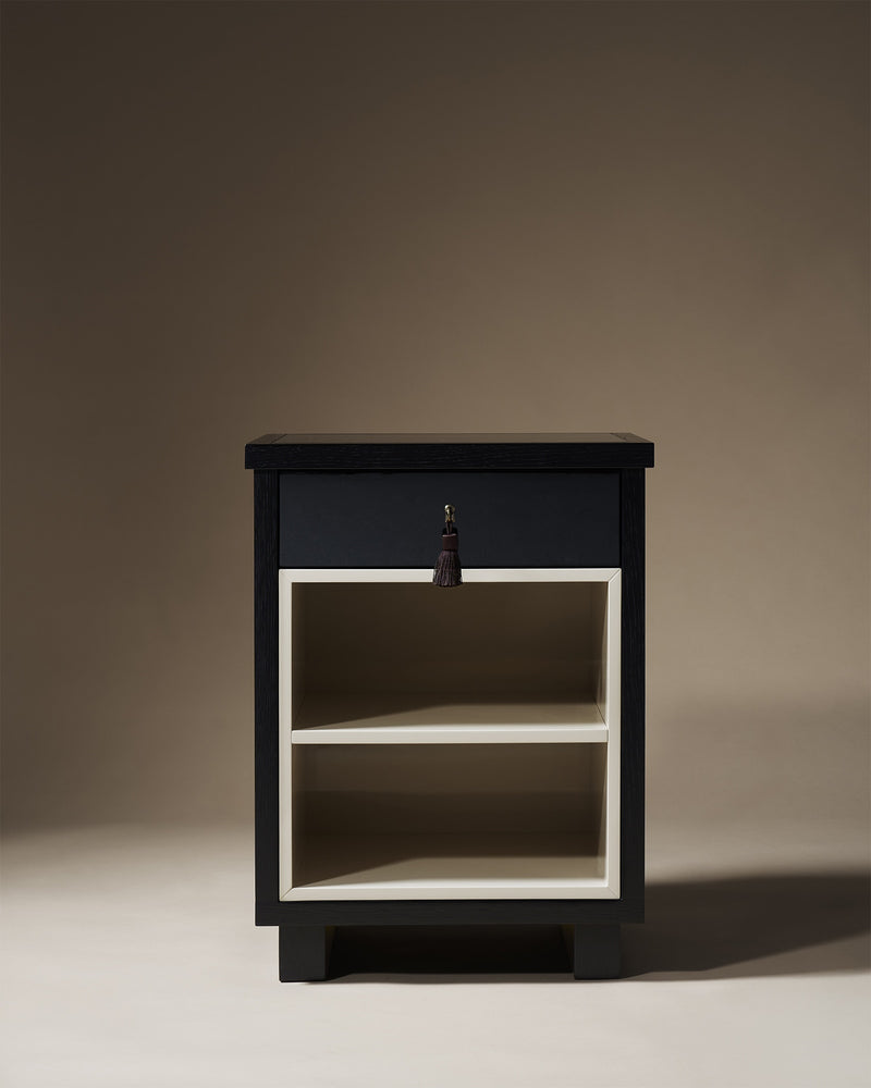 Lauren black bedside table with drawer and open shelving by Astrid Houssin
