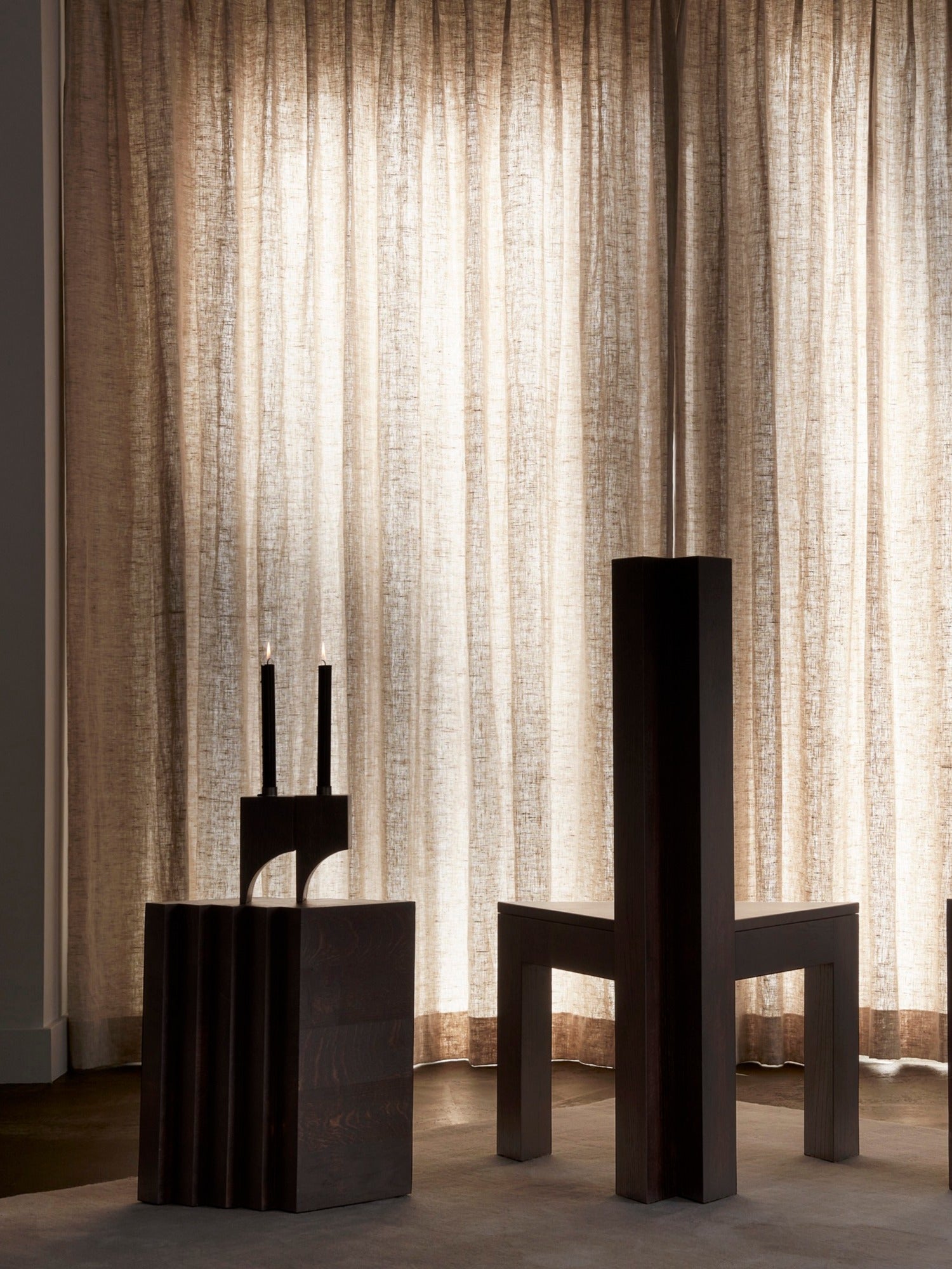 Scalae Side Table — dark wood detail in softly lit room