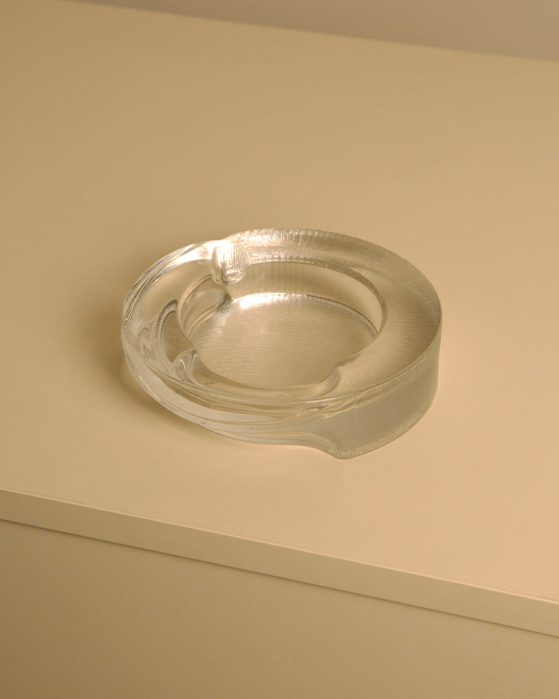 Clear crystal glass Azteca ashtray showing curved rim detail