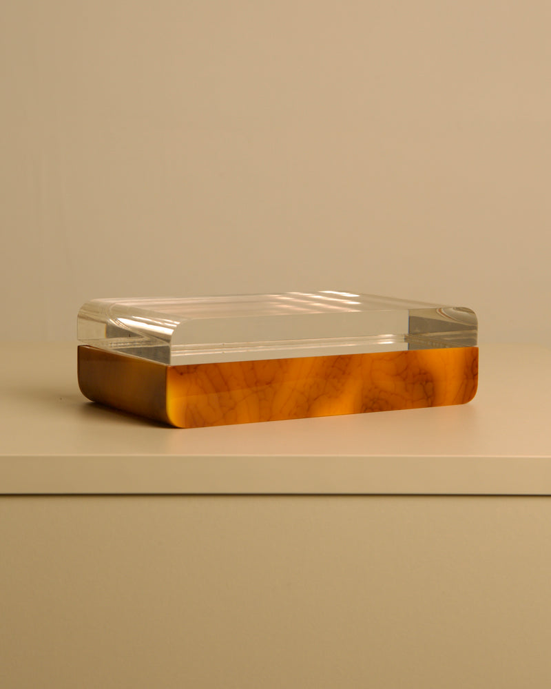 Italian box in plexiglass and brown bakelite, 70s — close-up of brown bakelite base