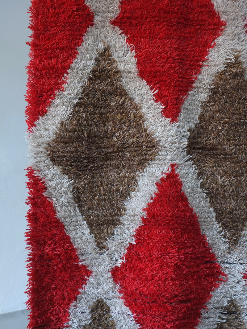 Scandinavian Red Rhombus Wool Rya Rug | Sweden | 1960s — close-up of textured red and brown fibers