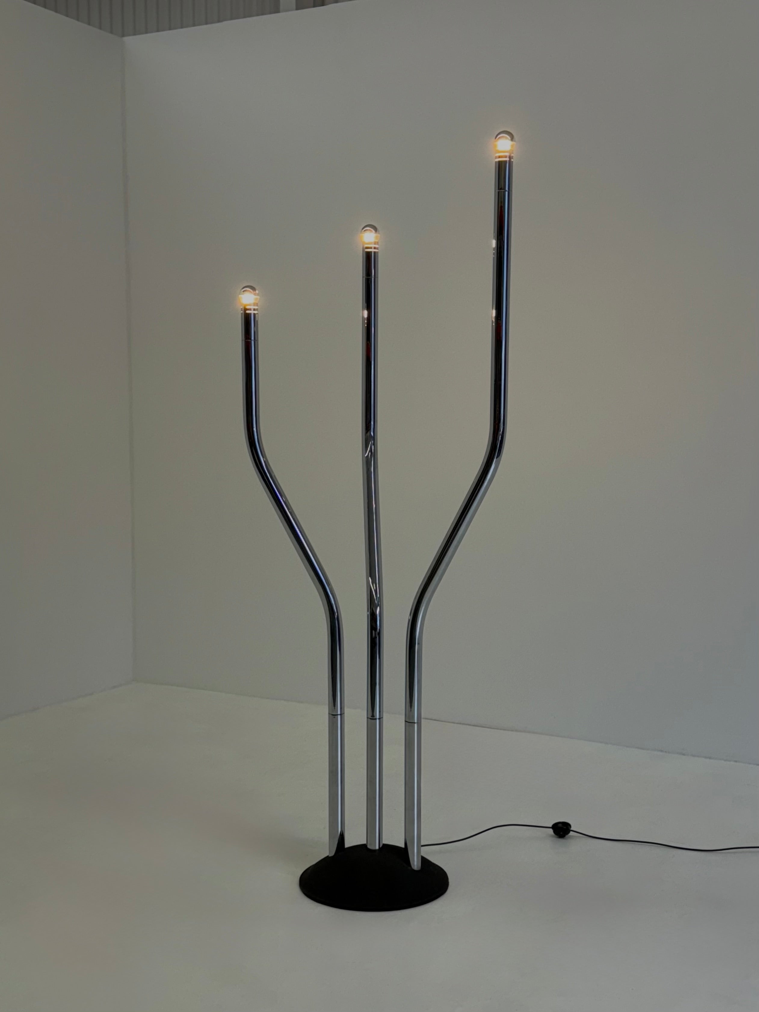 Chrome tubular frame designer floor lamp by Goffredo Reggiani — side angle