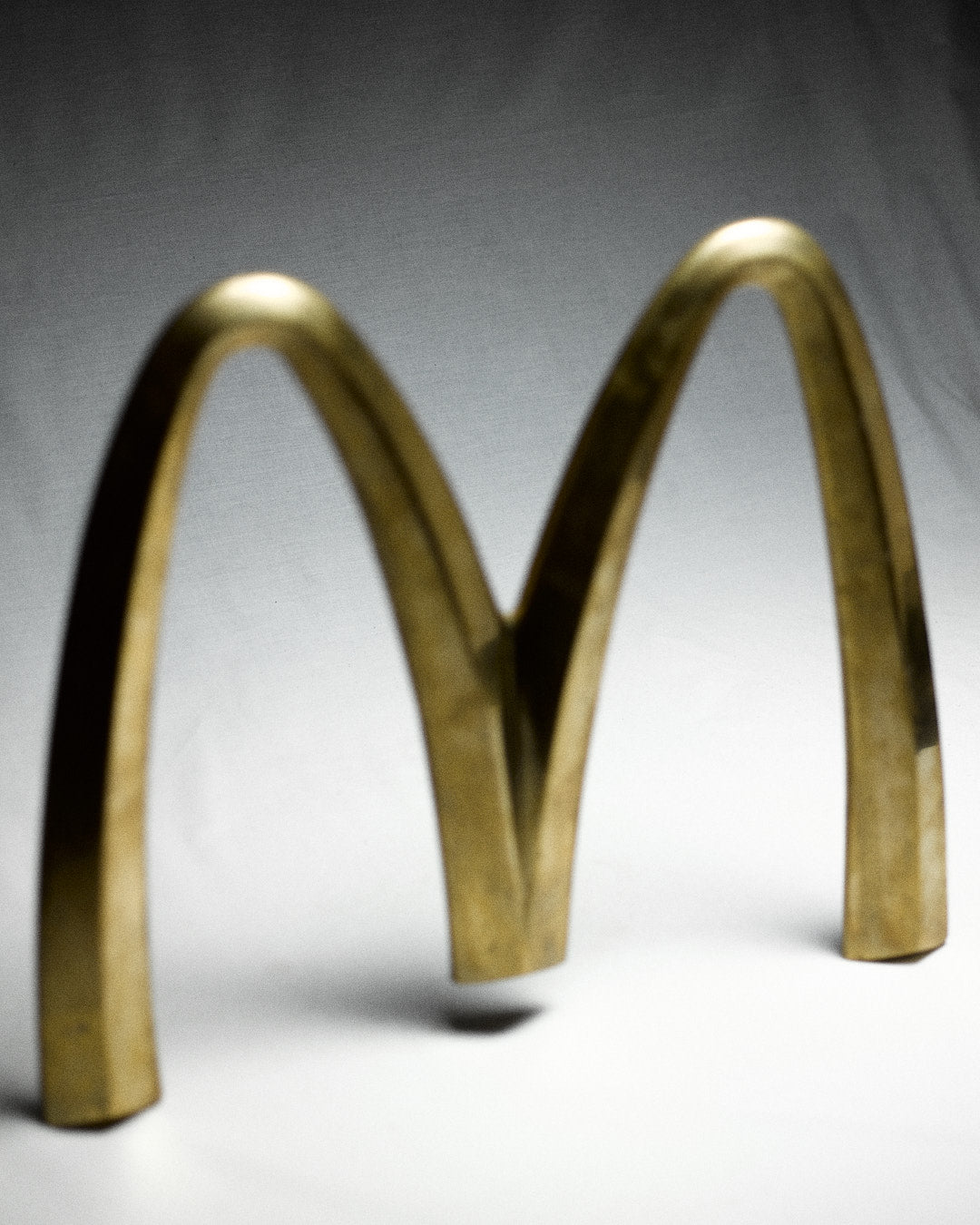 Vintage Italian McDonalds Sign in Brass — back view highlighting curved brass structure