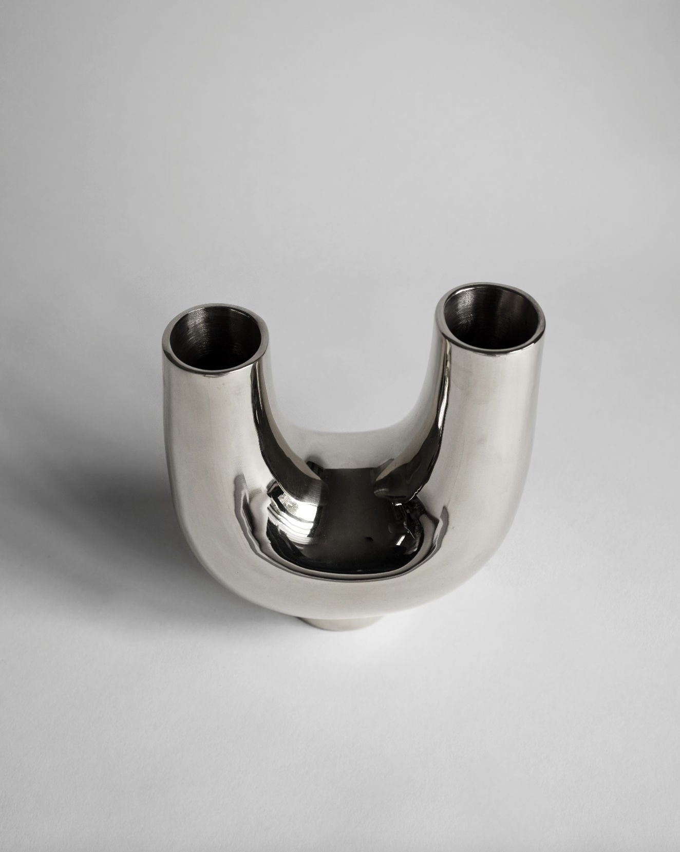 Kazumi Vase - Titanium — side angle showing polished metallic finish