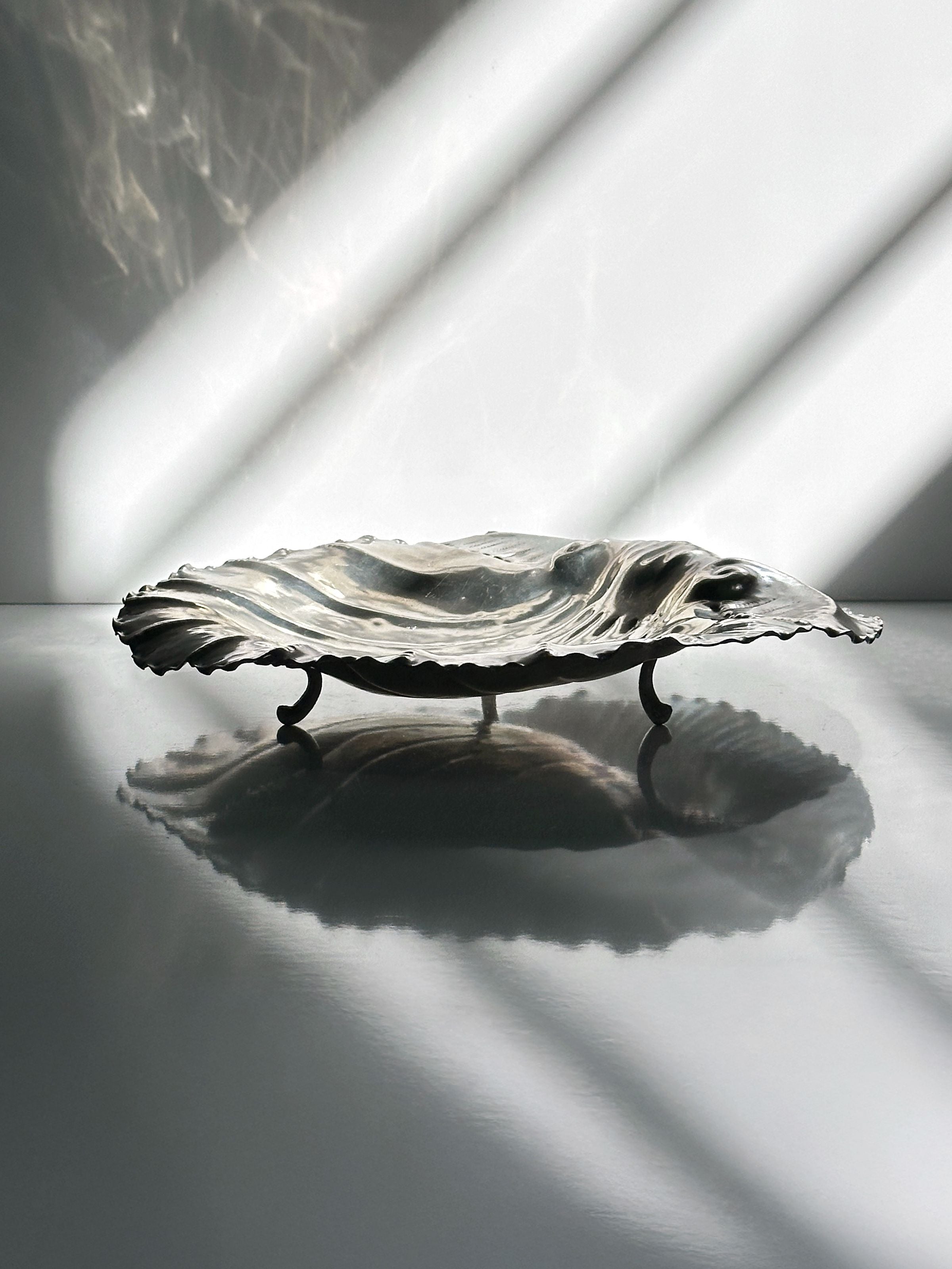 Handmade tin shell-shaped shallow bowl with elegant curved edges