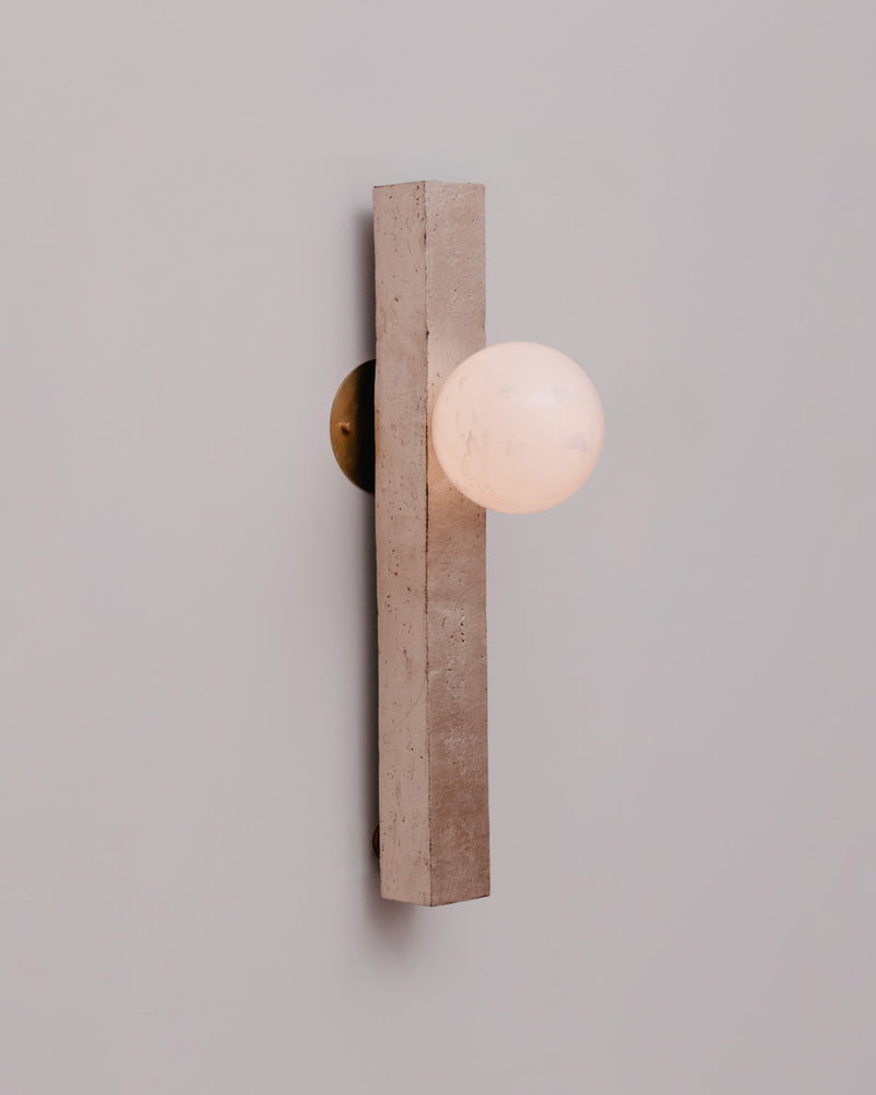 Conduit Linear Sconce 24.1 — close-up of concrete and globe light
