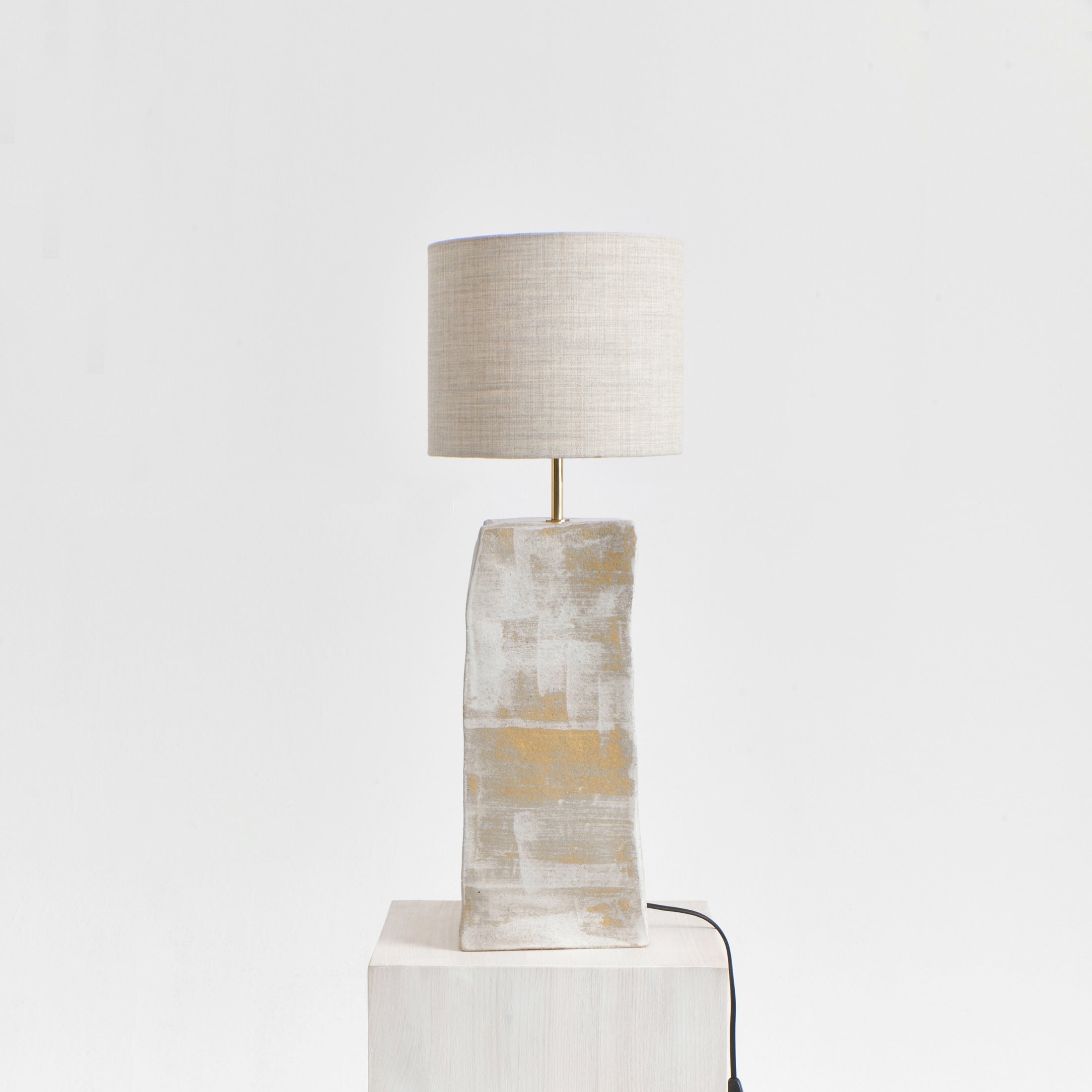 Rectangular Ceramic Lamp — front view on light wood pedestal