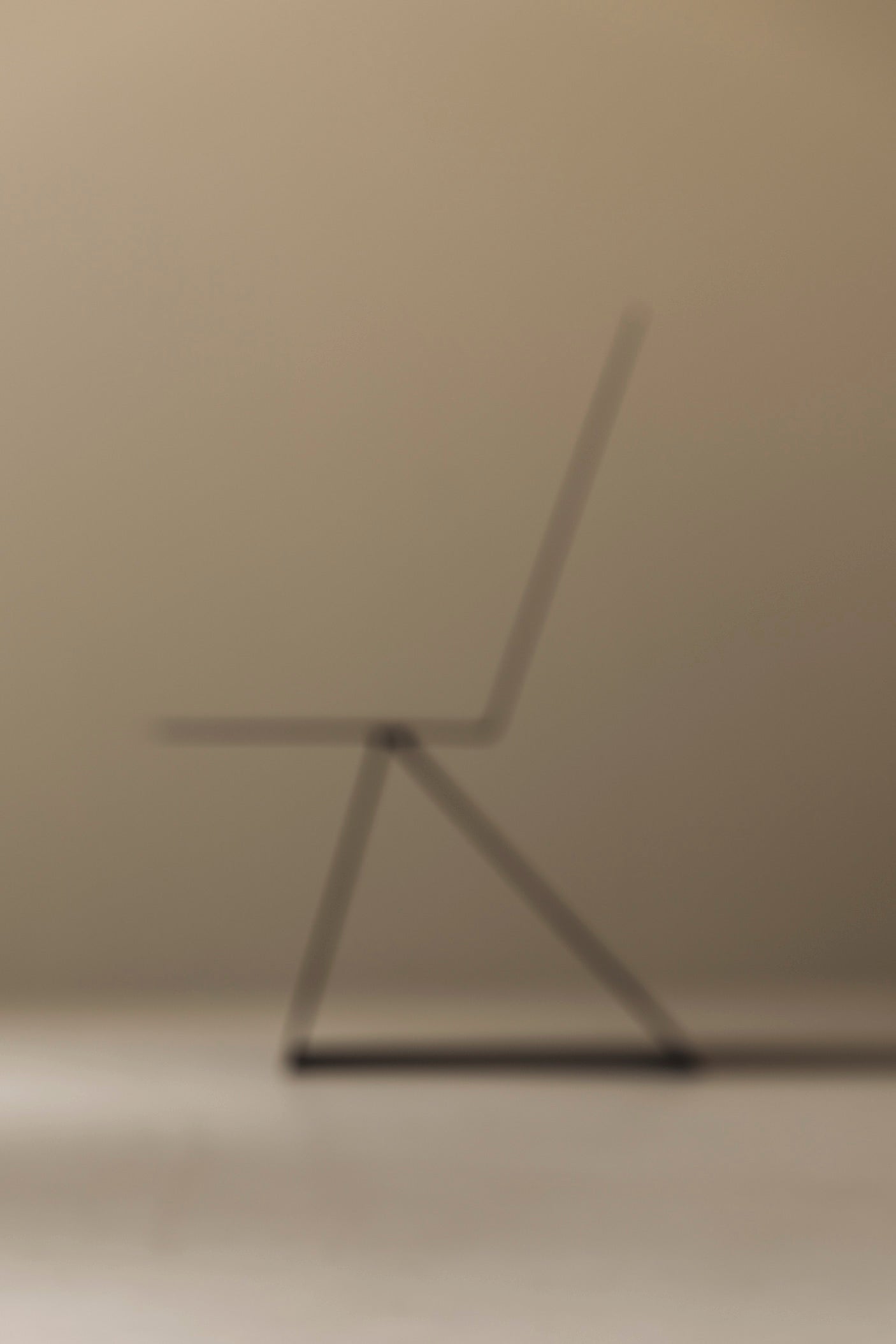 Prototype Modernist Architectural Side Chair, 1980s — blurred side profile against neutral background