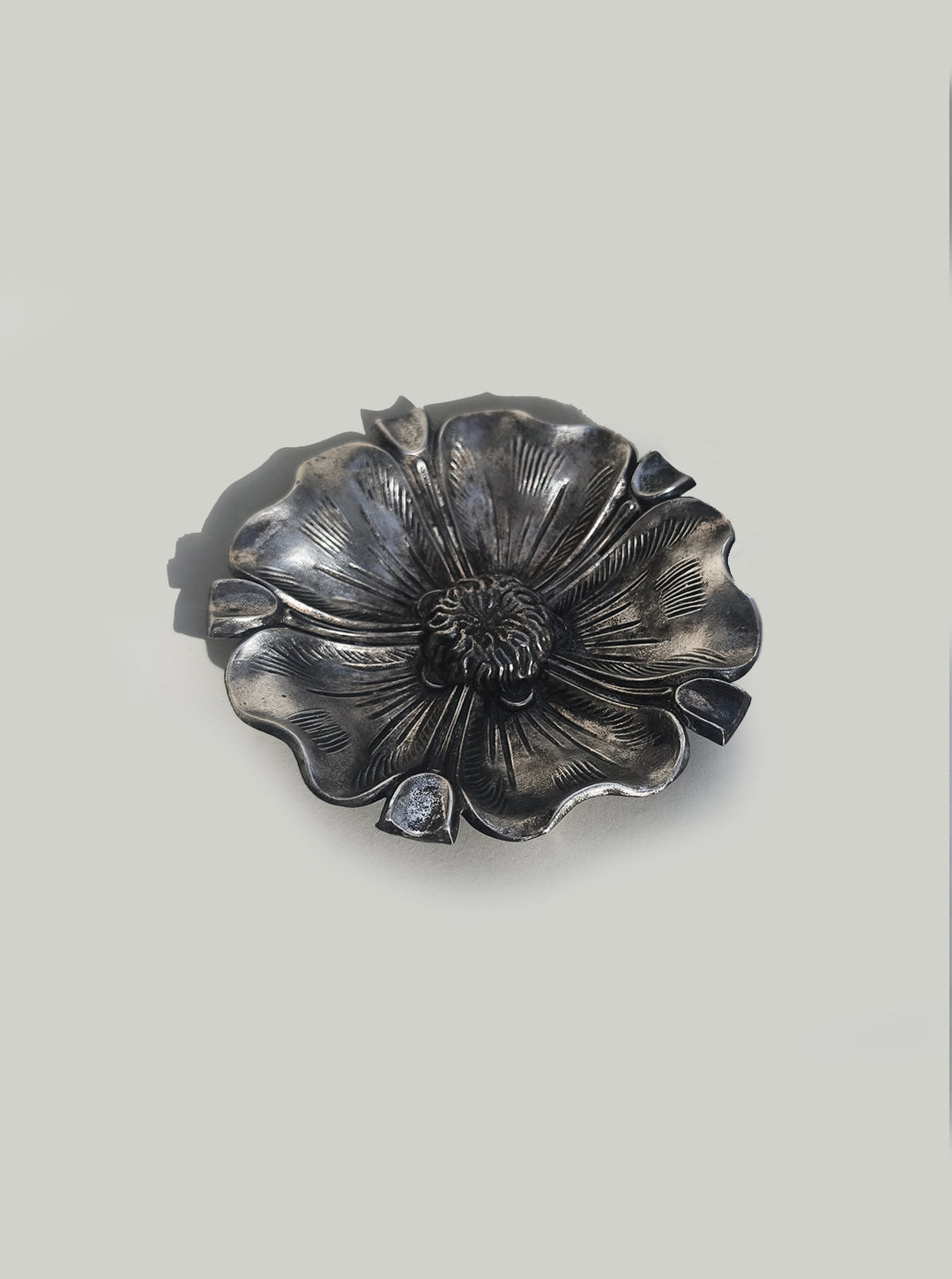 Pewter Floral Ashtray — close-up