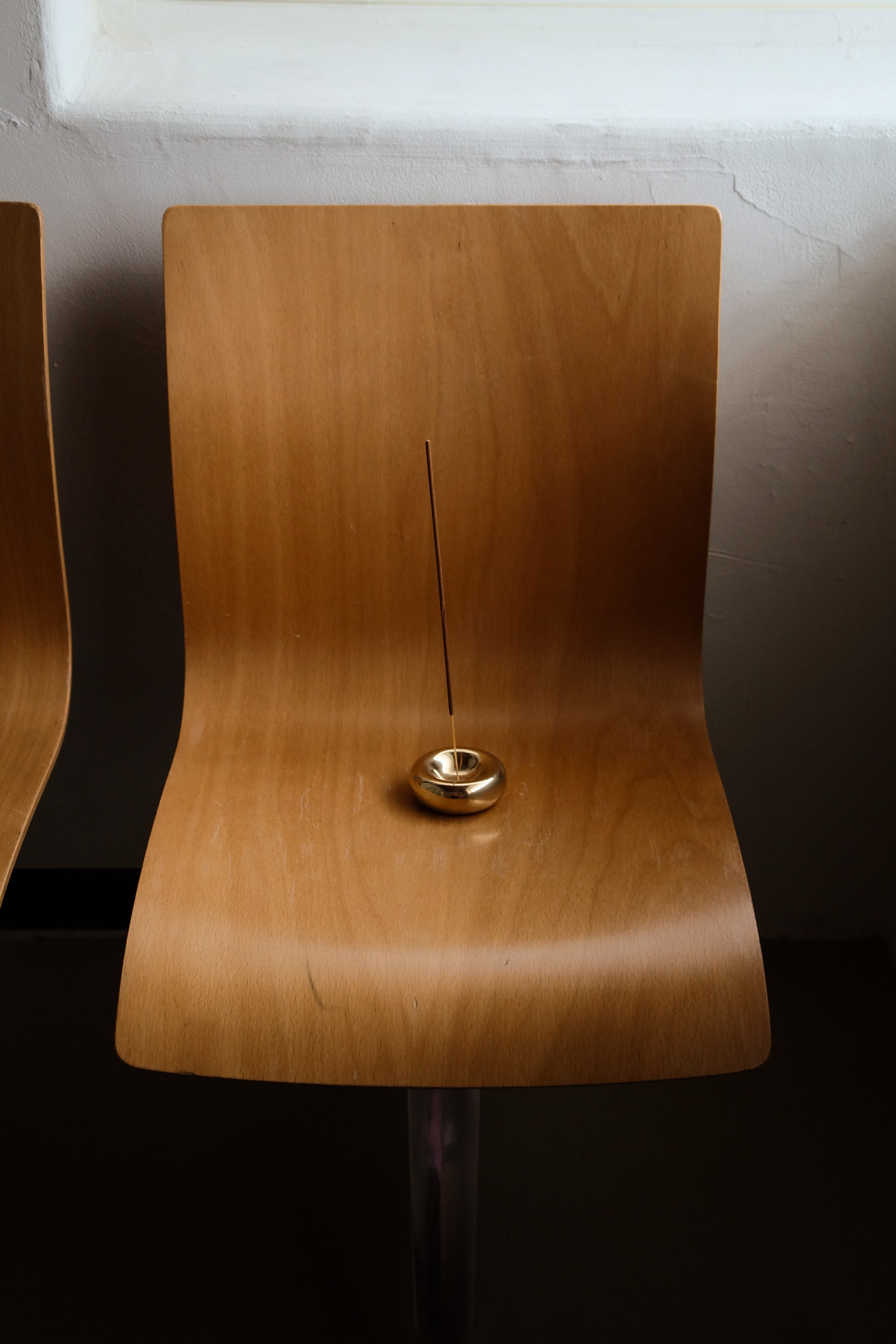 BASIN Incense Holder — side view on wooden chair