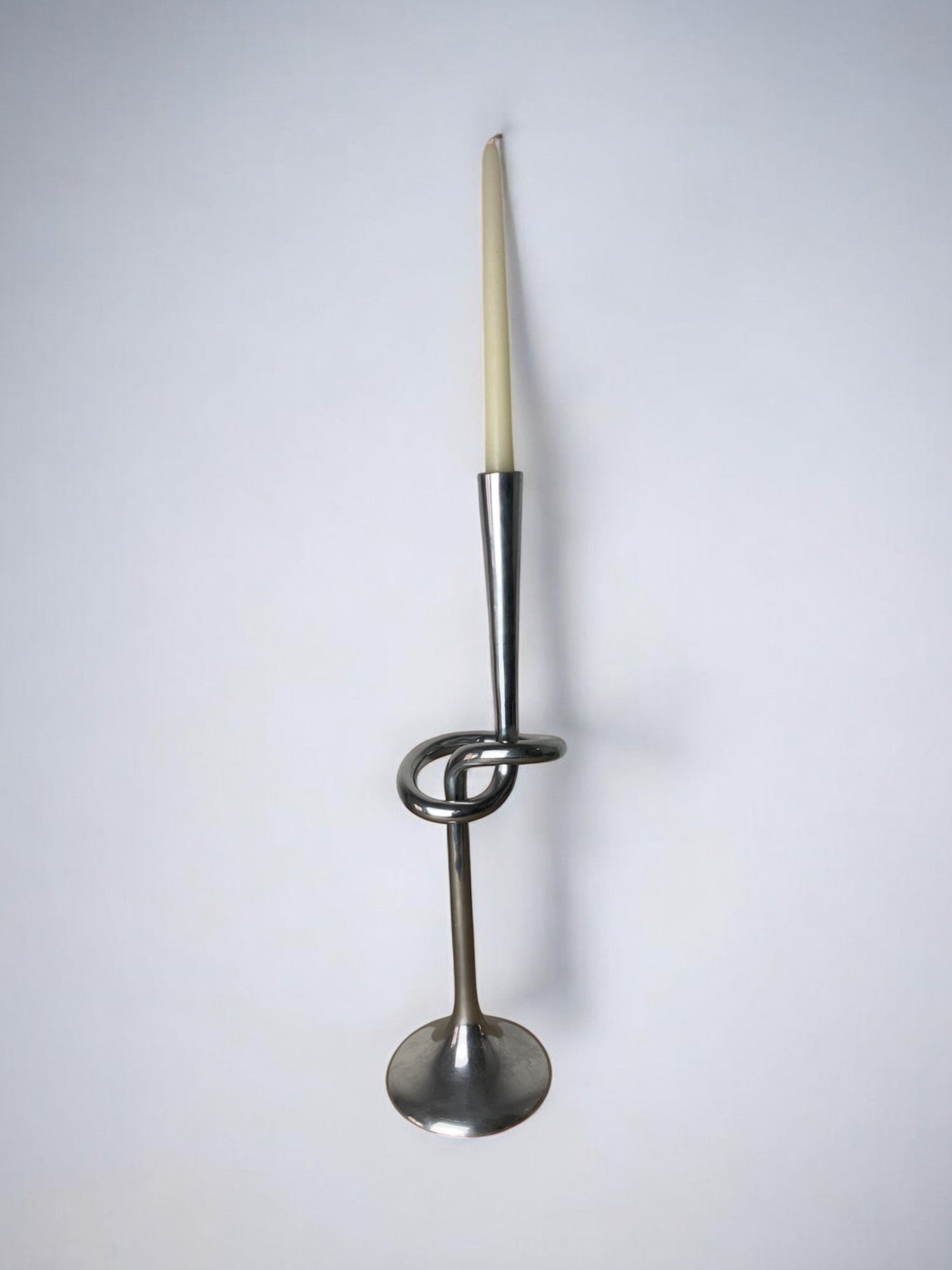 XL knotted candlestick in Solid aluminum, Italy, 1980 — lifestyle setting