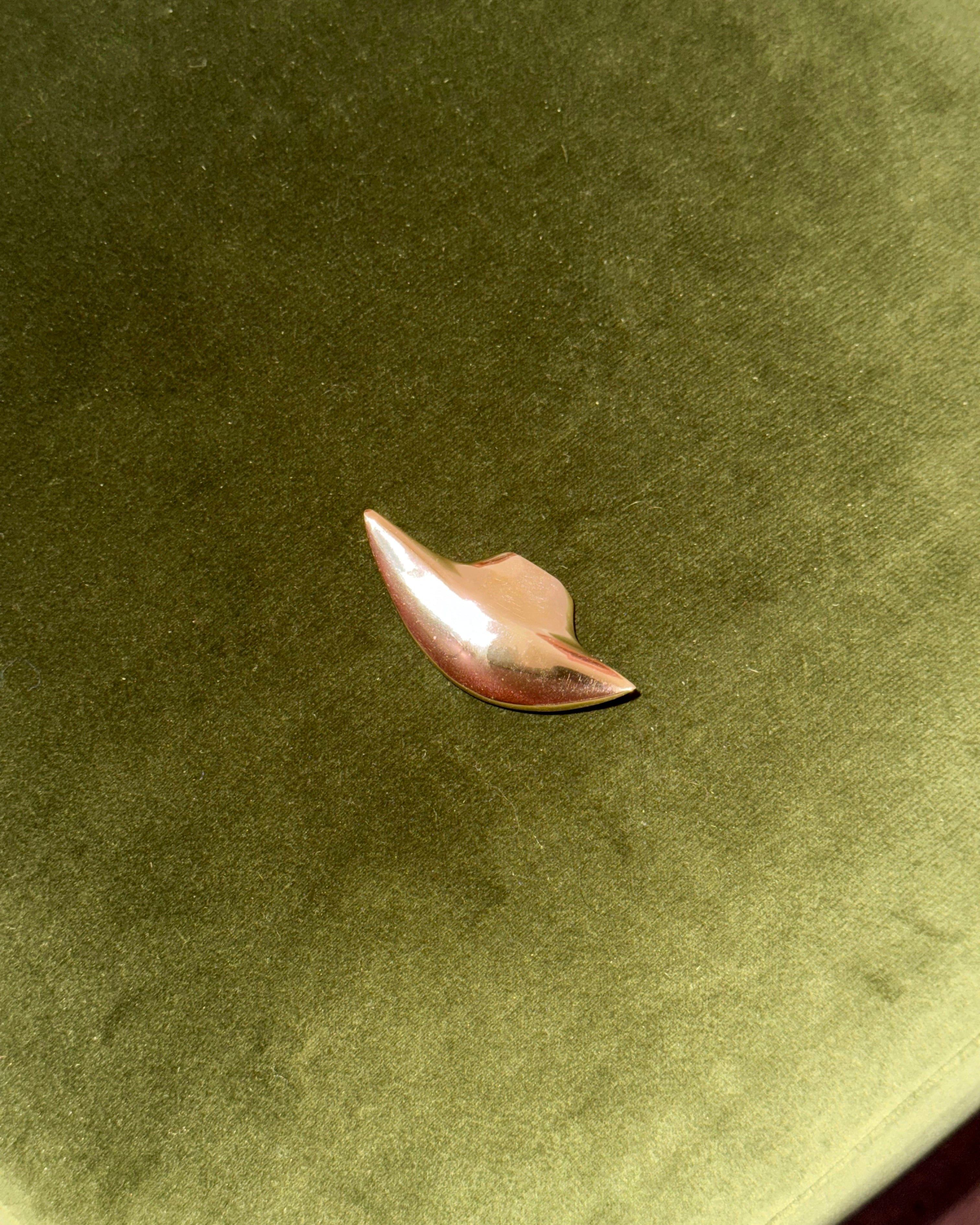 PETAL Knob/Hook — top view on green velvet surface