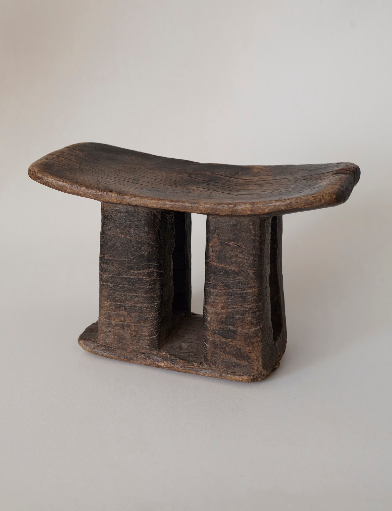 West African Monoxyle Stool in Dark Patinated Wood — lifestyle setting