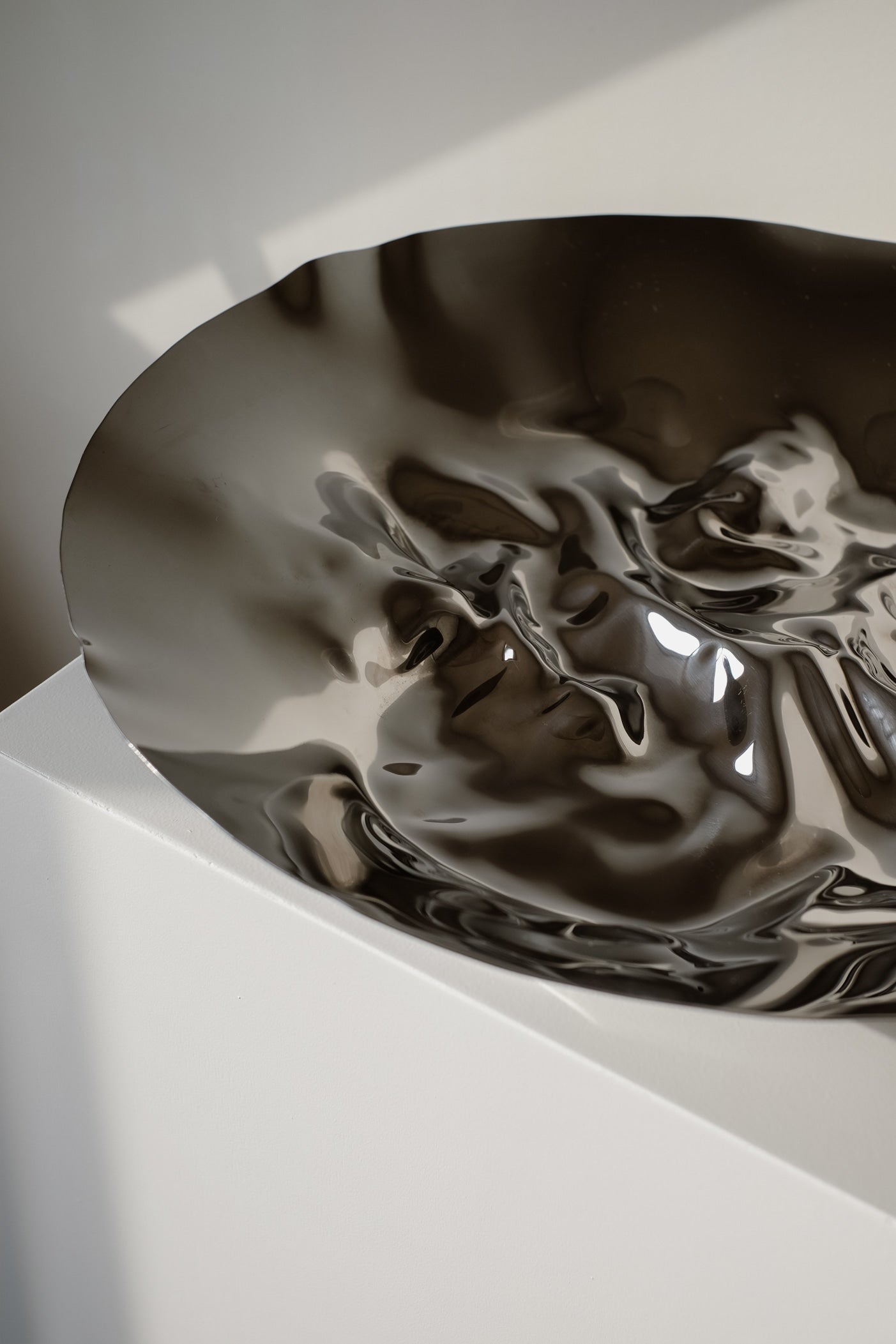 Chrome Curved Decorative Bowl — close-up of reflective chrome surface