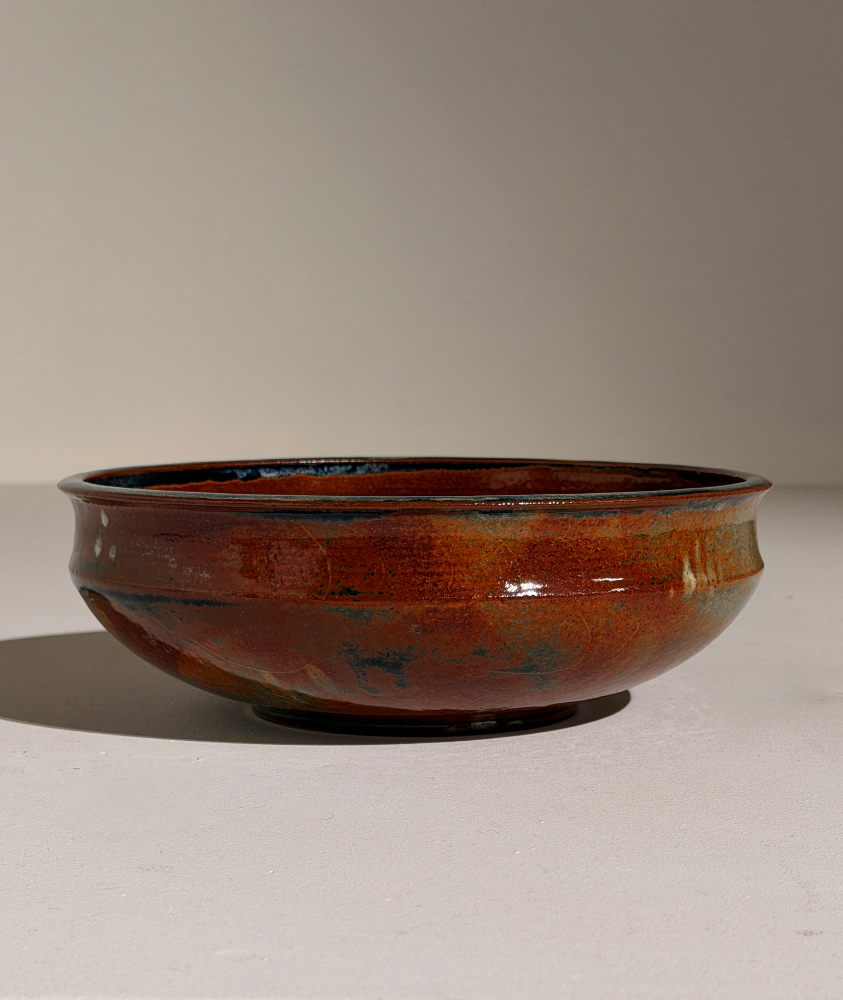 Ceramic dish by Elisabeth Wallet, circa 1960–1970 — side view highlighting earthy glaze finish