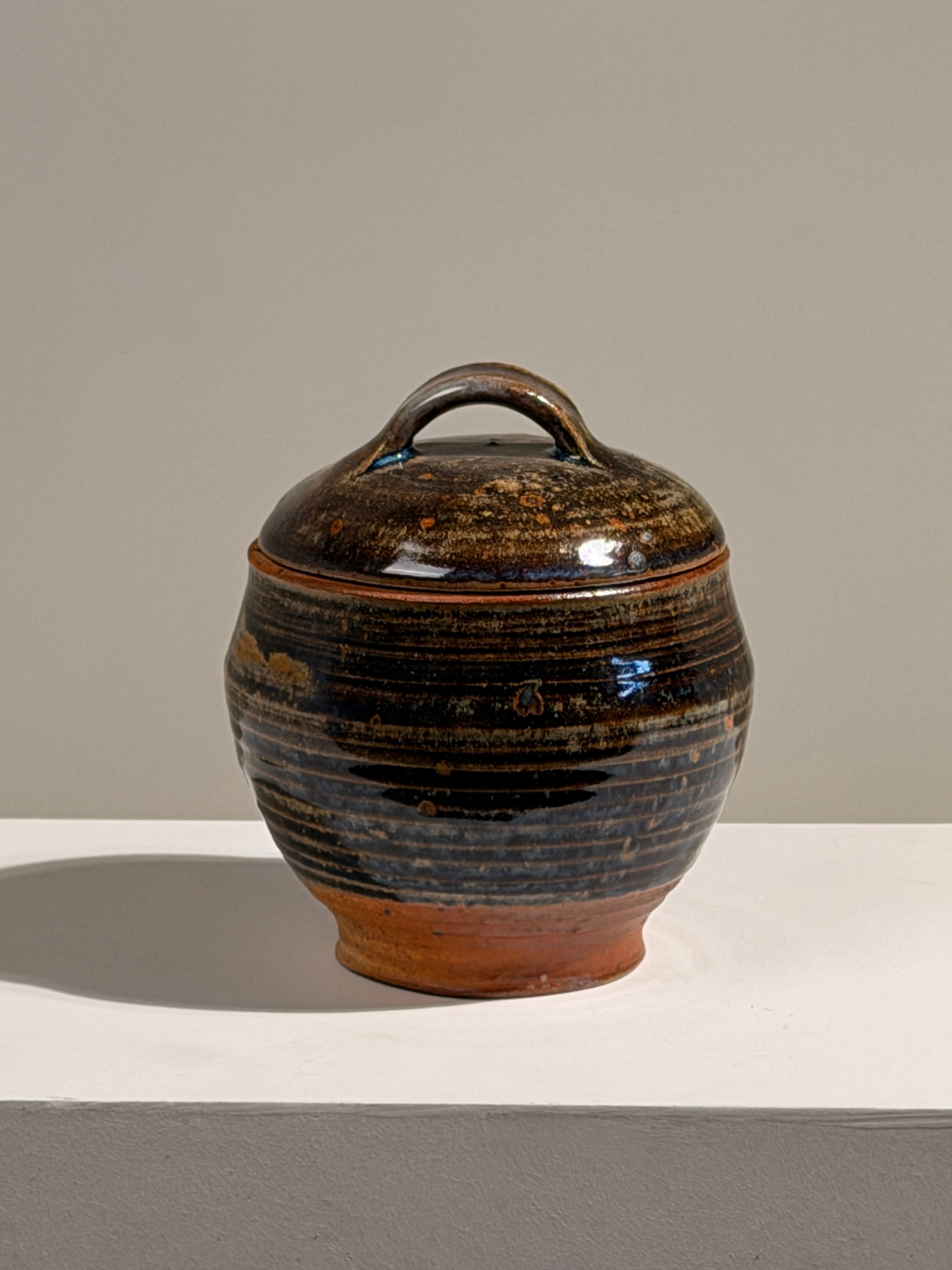 Covered stoneware pot, France, circa 1960 — detail view