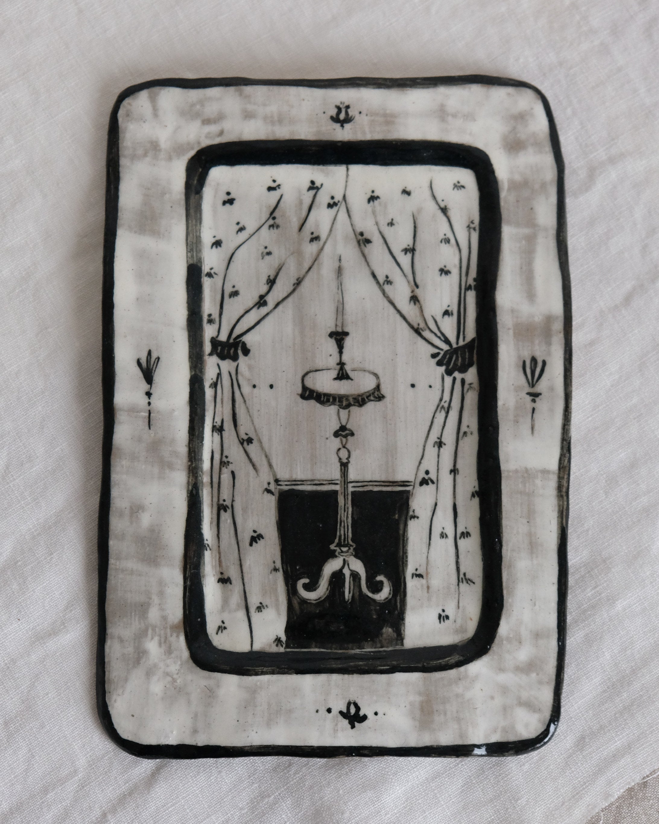 Entrance - Hand Painted Ceramic Plate — close-up of black and white design