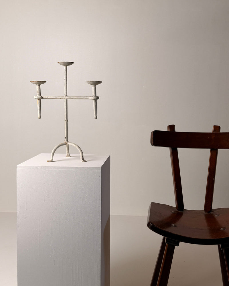 White-patinated Iron Candelabrum, France, early 20th century — front view on white pedestal