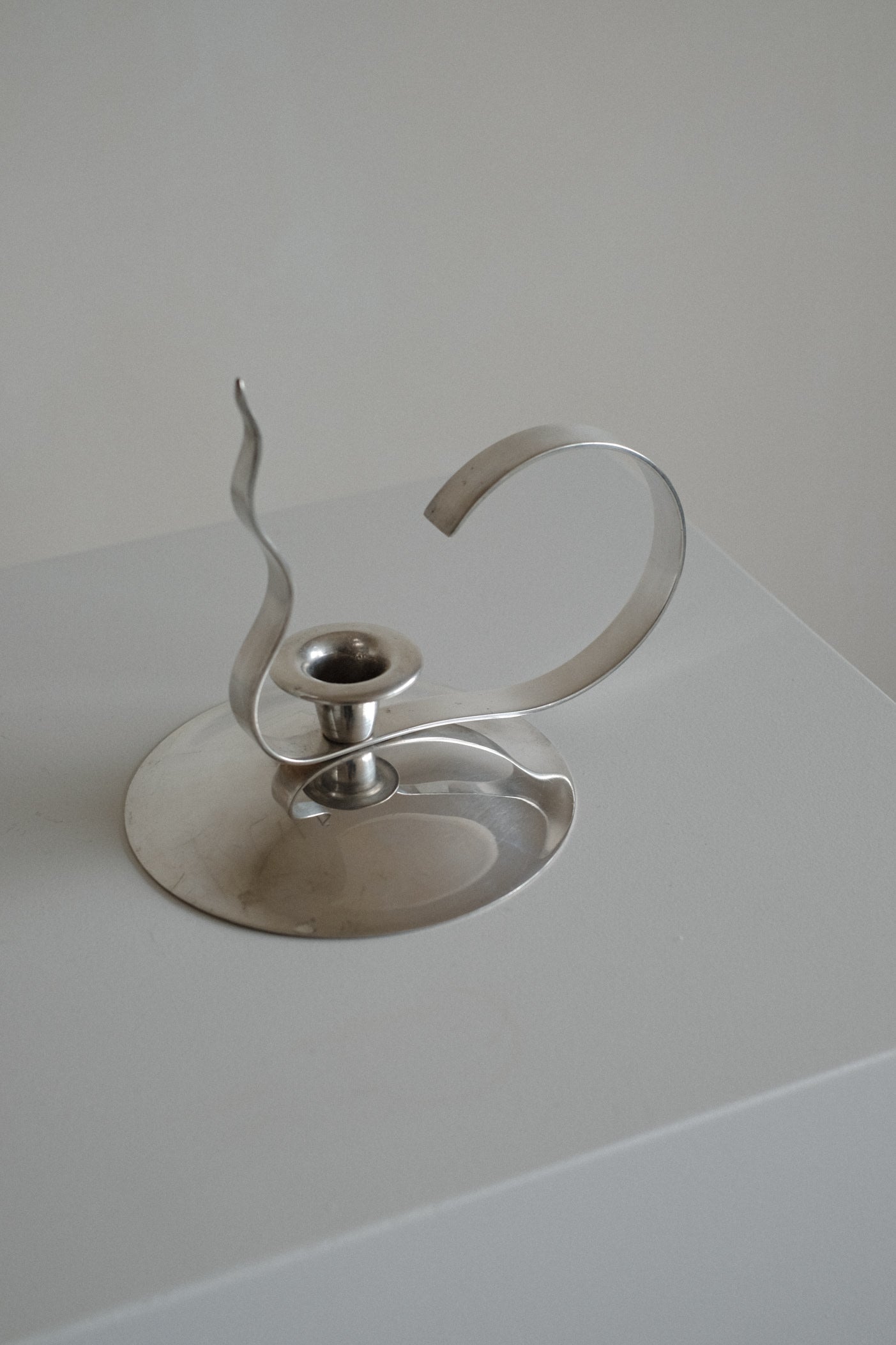 Silver-Plated Candle Holder — angled view on minimalist pedestal