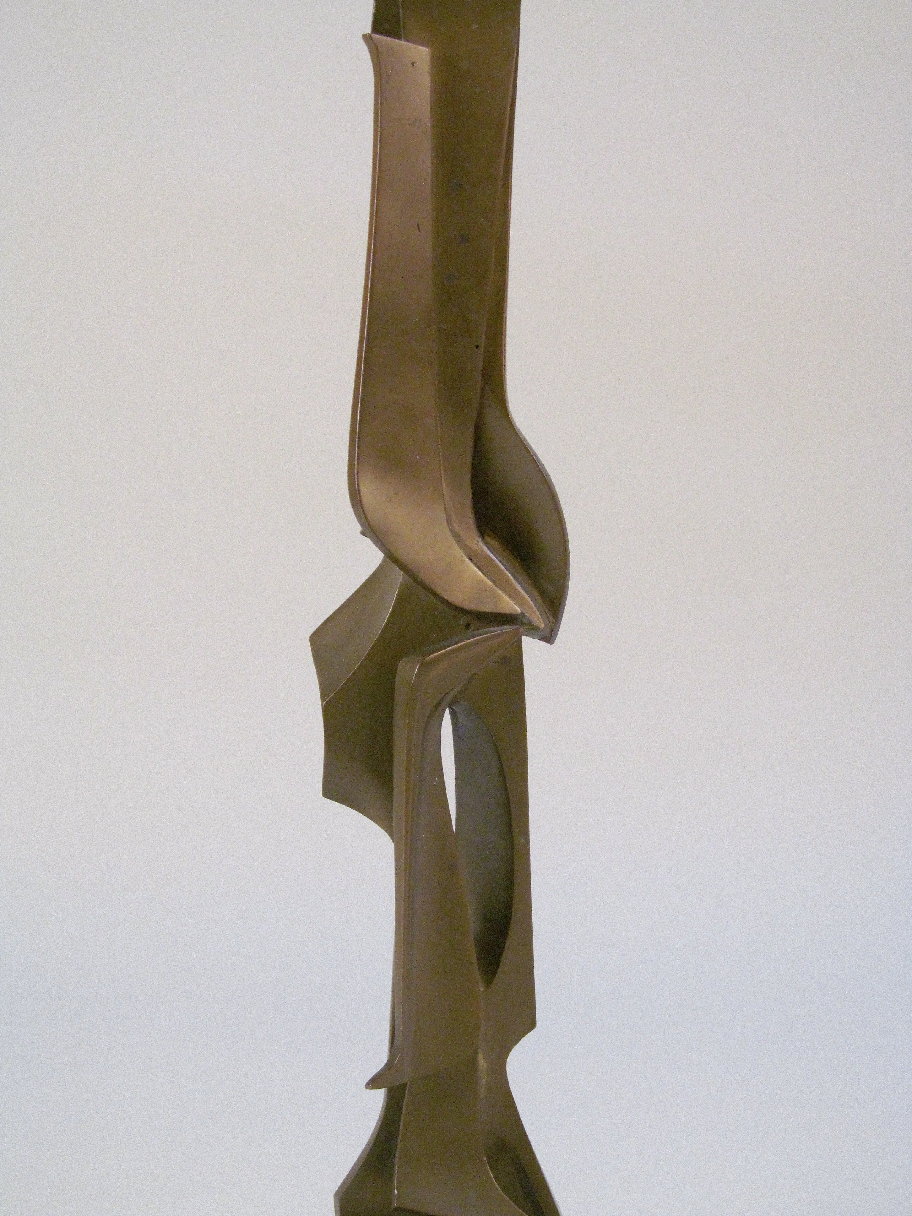 Abstract Bronze Sculpture — angled view highlighting smooth bronze curves