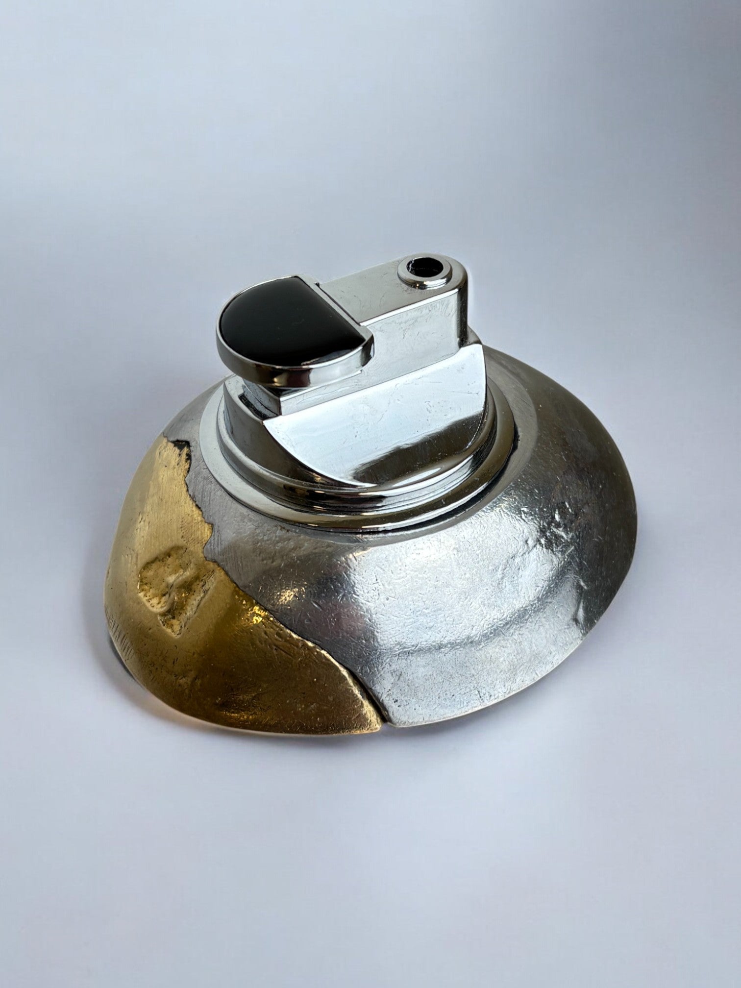 Brutalist lighter by Art3, Bronze and aluminum, Spain, 1970's — lifestyle setting