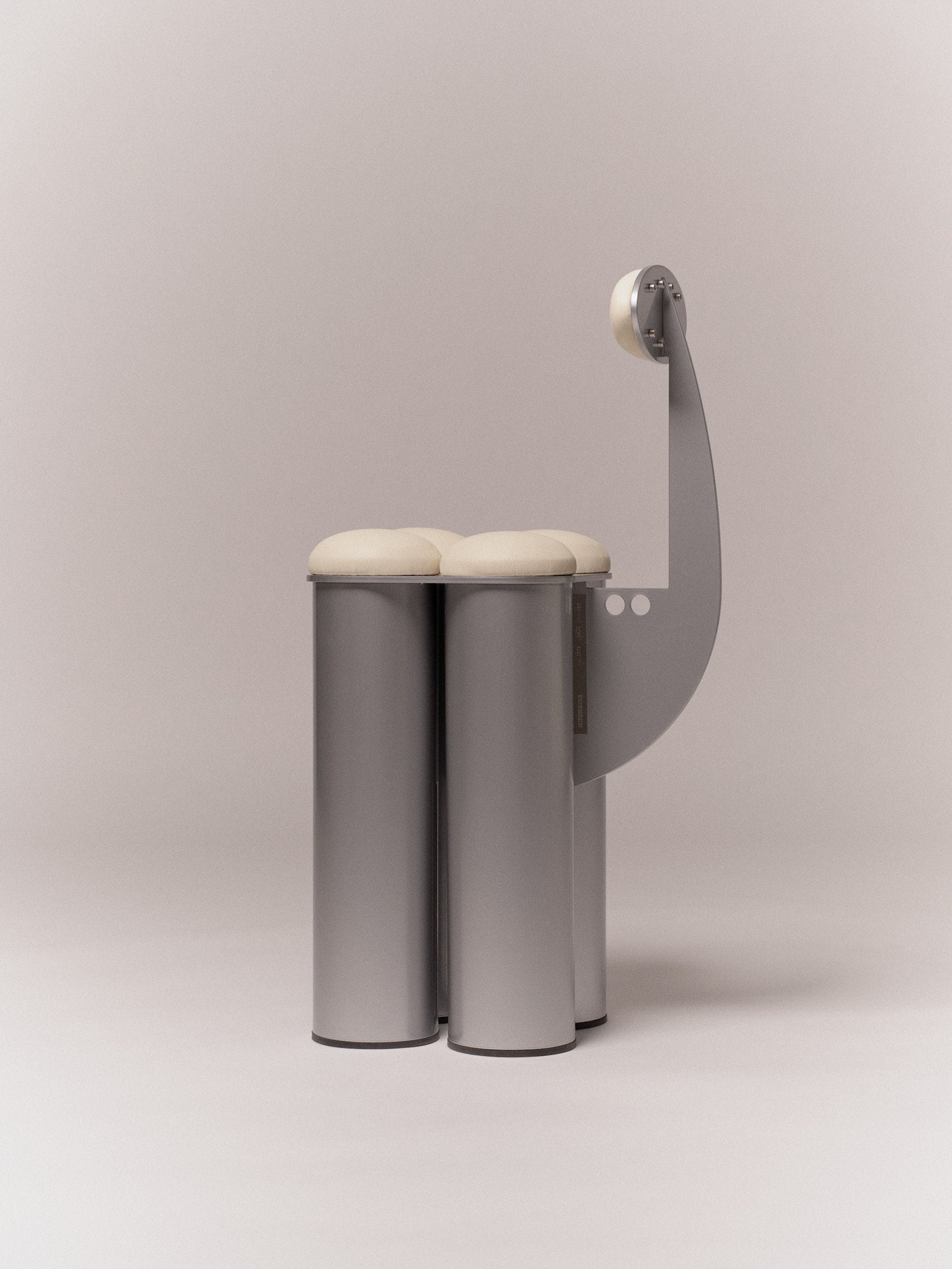 Giulio Stool — side view showing metallic base and round seat