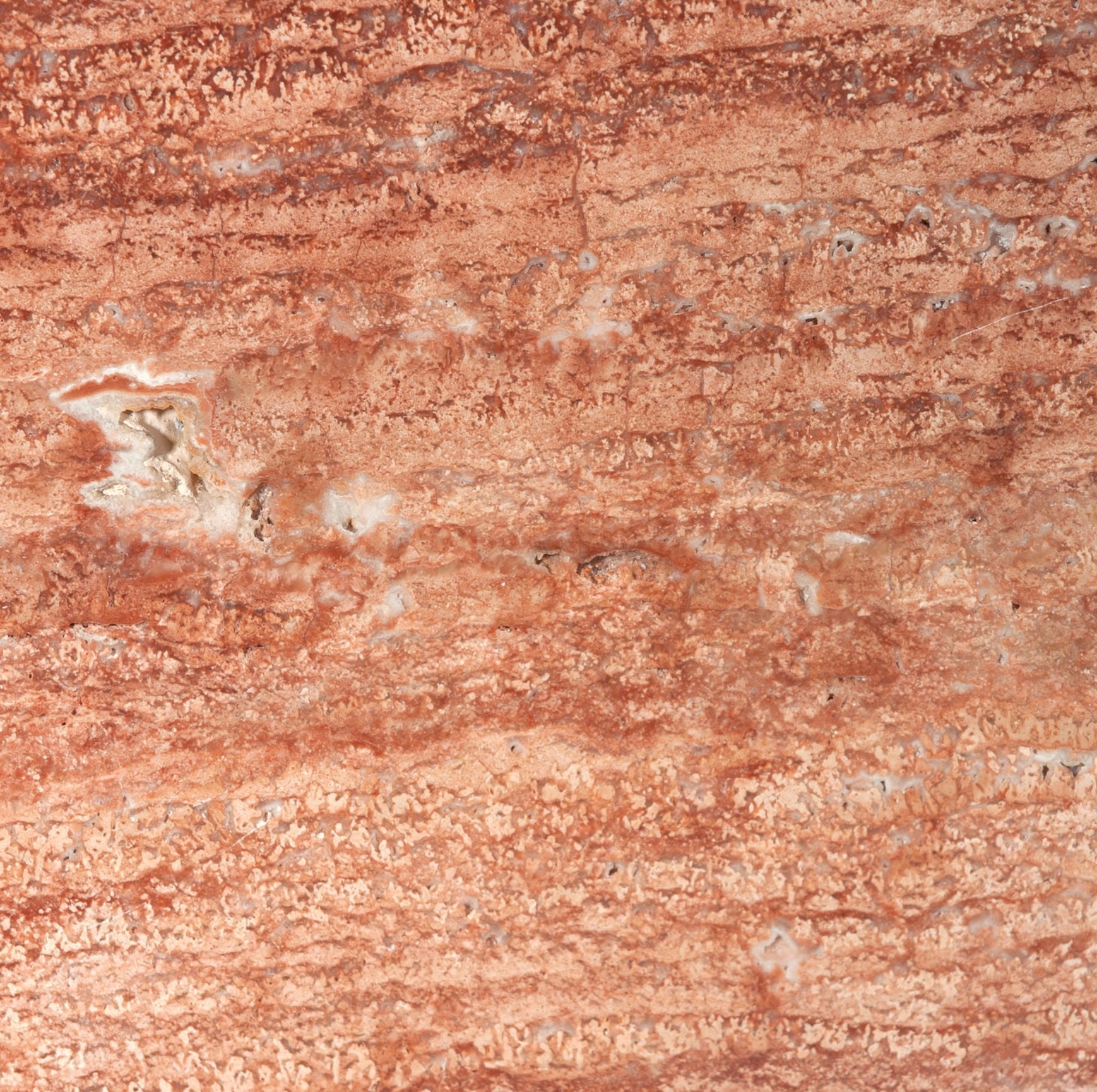 Firme Dining Table — top view of textured stone surface