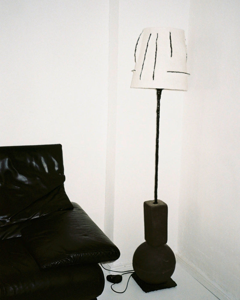 Rebirth II floor lamp with sculptural base in modern living room