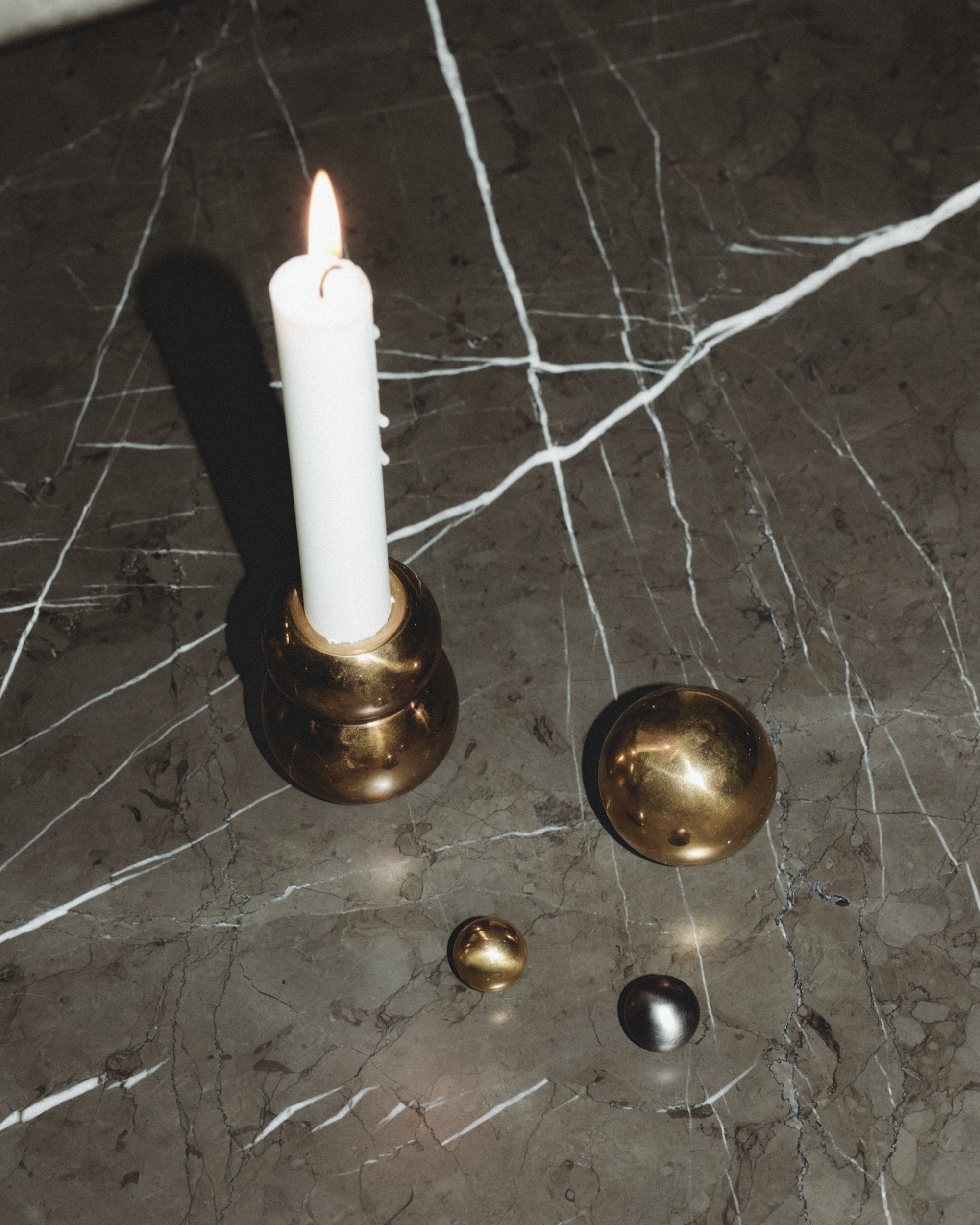 CERCLE Cabinet Knob Large — detail of brass knob on marble surface