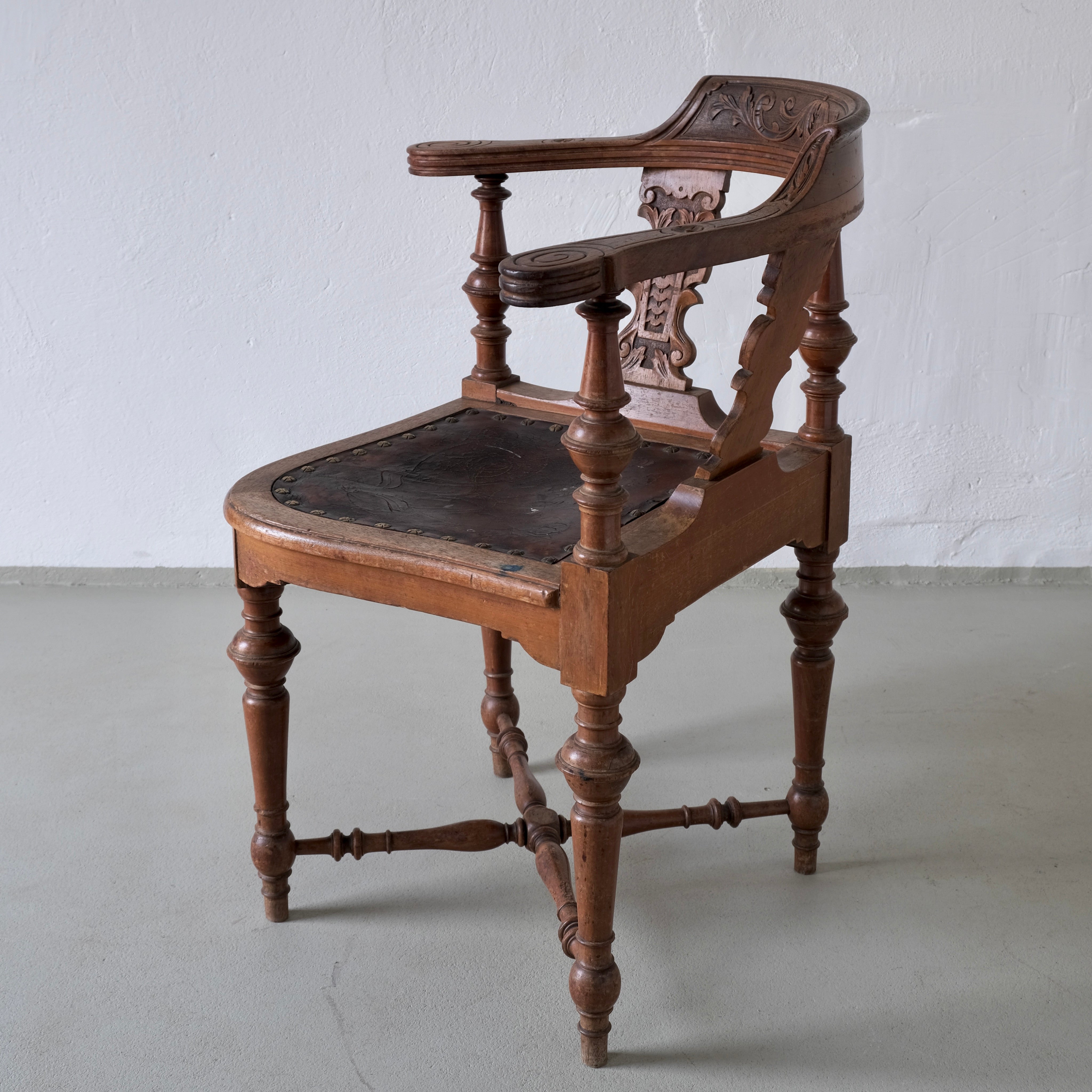 Antique Carved Corner Chair with Leather Seat