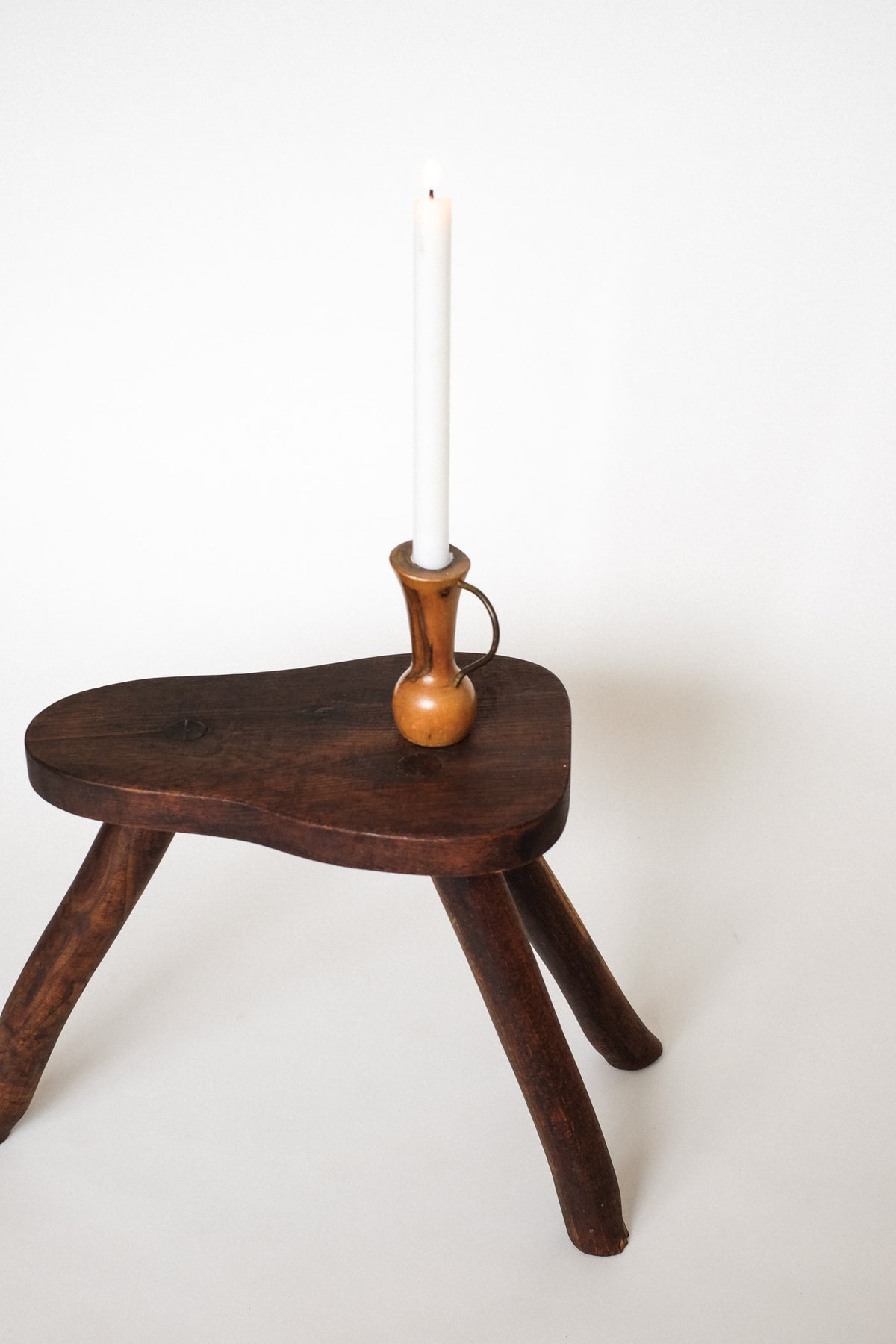 Rustic Vintage Three-Legged Wooden Stool — side angle