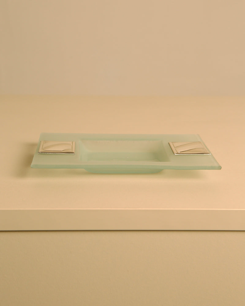 Rectangular crystal and silver-plated metal valet tray by Pierre Cardin, 1980s — angled view on neutral background