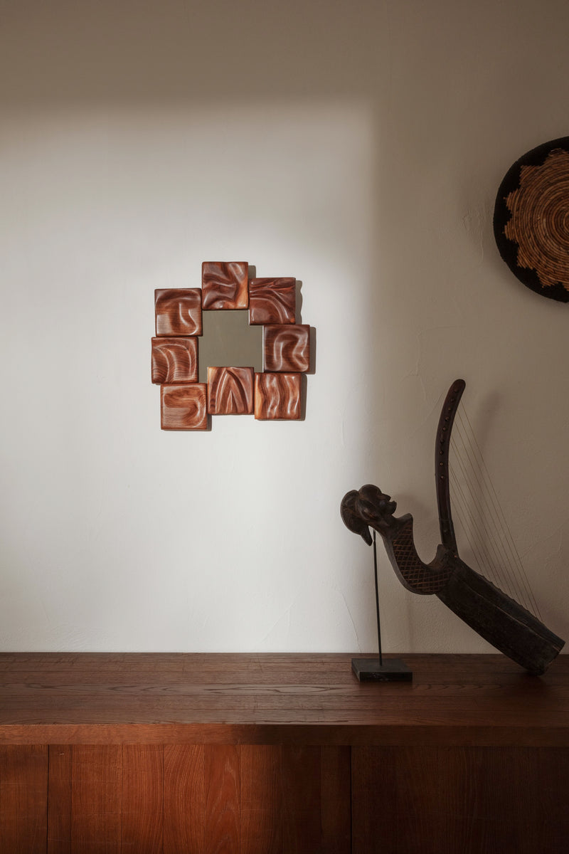Small Catarina Mirror — close-up of textured brown ceramic tiles