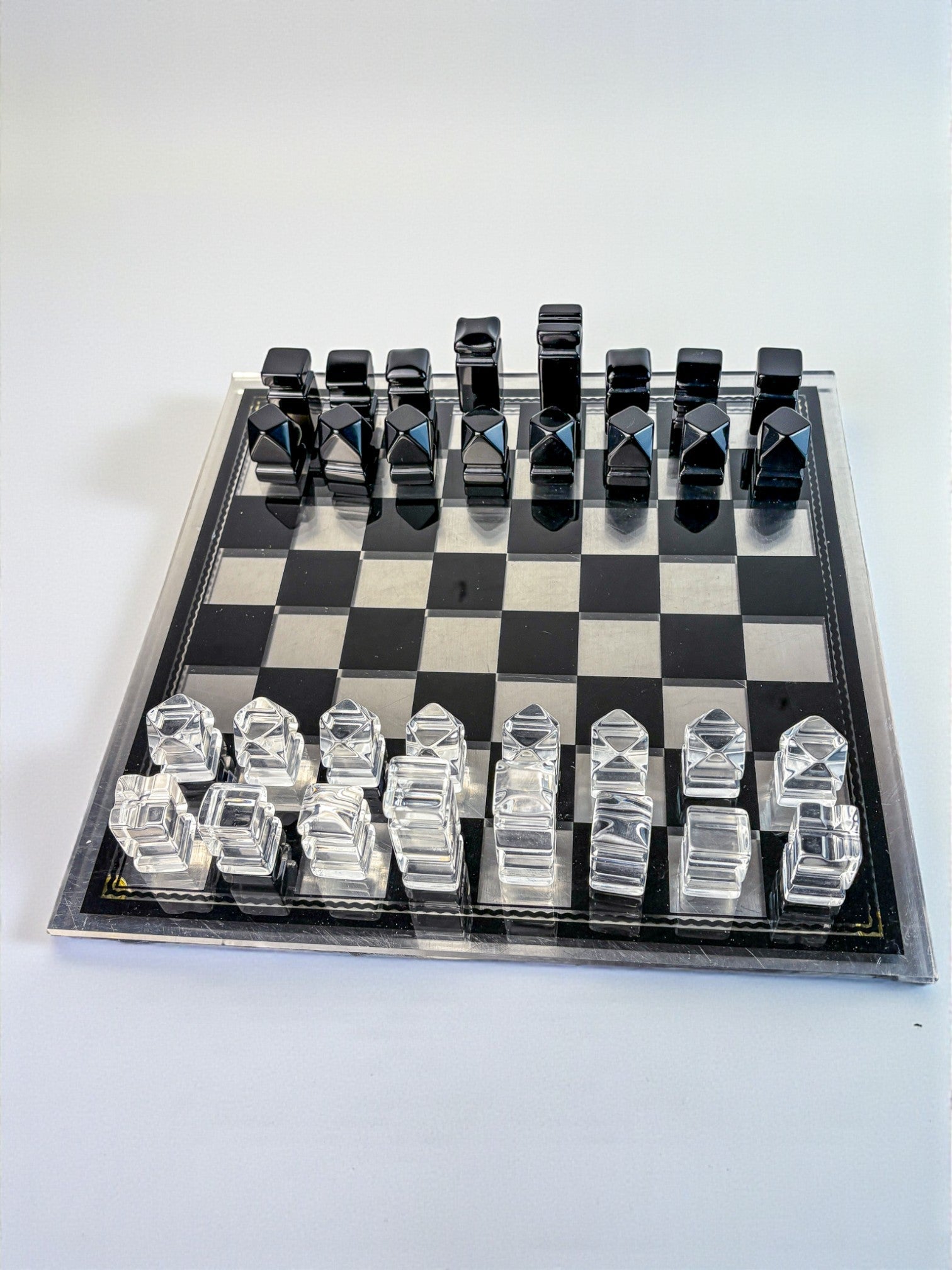 Felice Antonio Botta Acrylic Chessboard, Italy, 70s — top view of clear and black acrylic pieces
