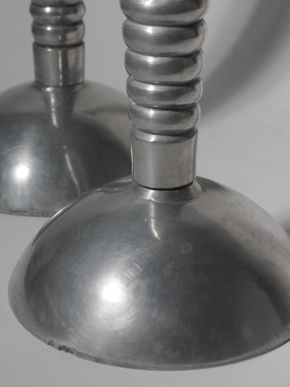 Pair Of Massive Rimmed Aluminum Candle Holders — side angle