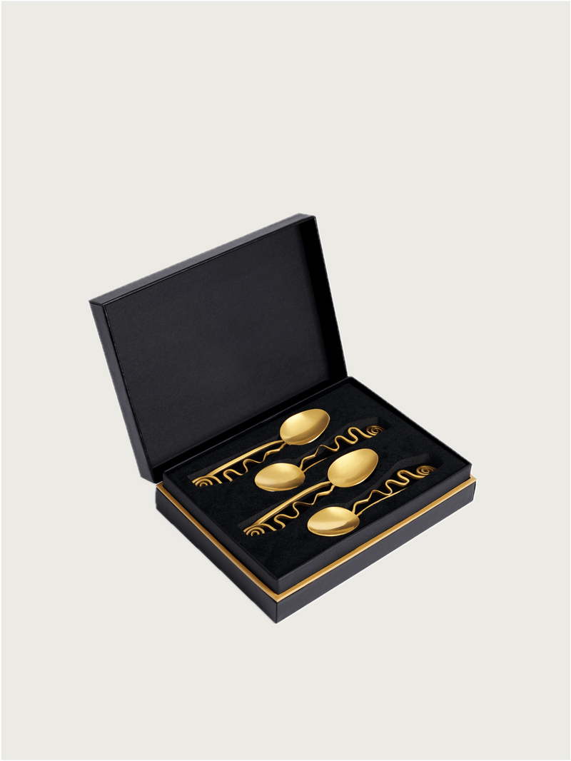 Set of 4 Spirale Cocktail Spoons — close-up of gold spoons in black box