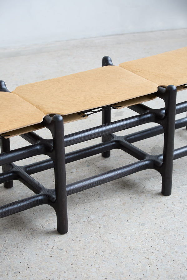 Lyndoe Bench in Solid Wood and Leather — close-up of leather seat and wooden frame