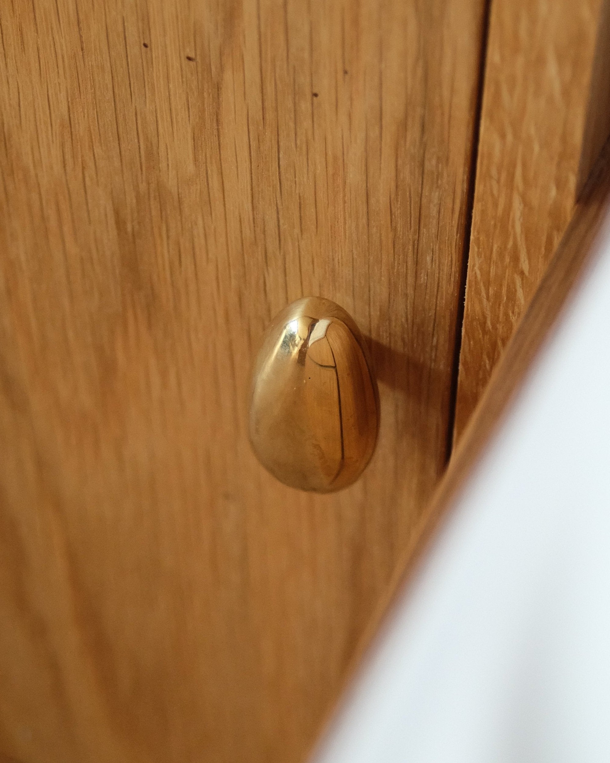 MOMI Cabinet Knob/Wall Hook Long Mini — back view of brass knob on wood