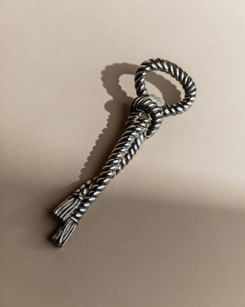 Twisted rope design detail of 1940s silver plated bottle opener