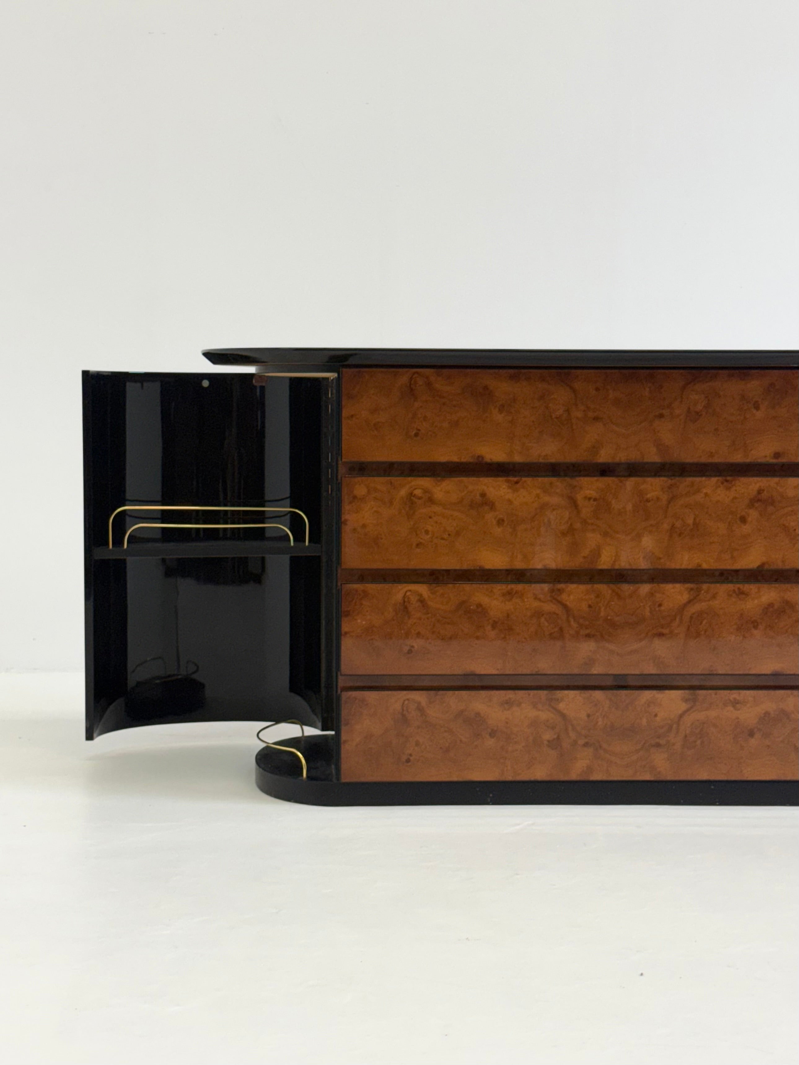 Vintage Voltan chest of drawers made of lacquered burl wood with bar — in context